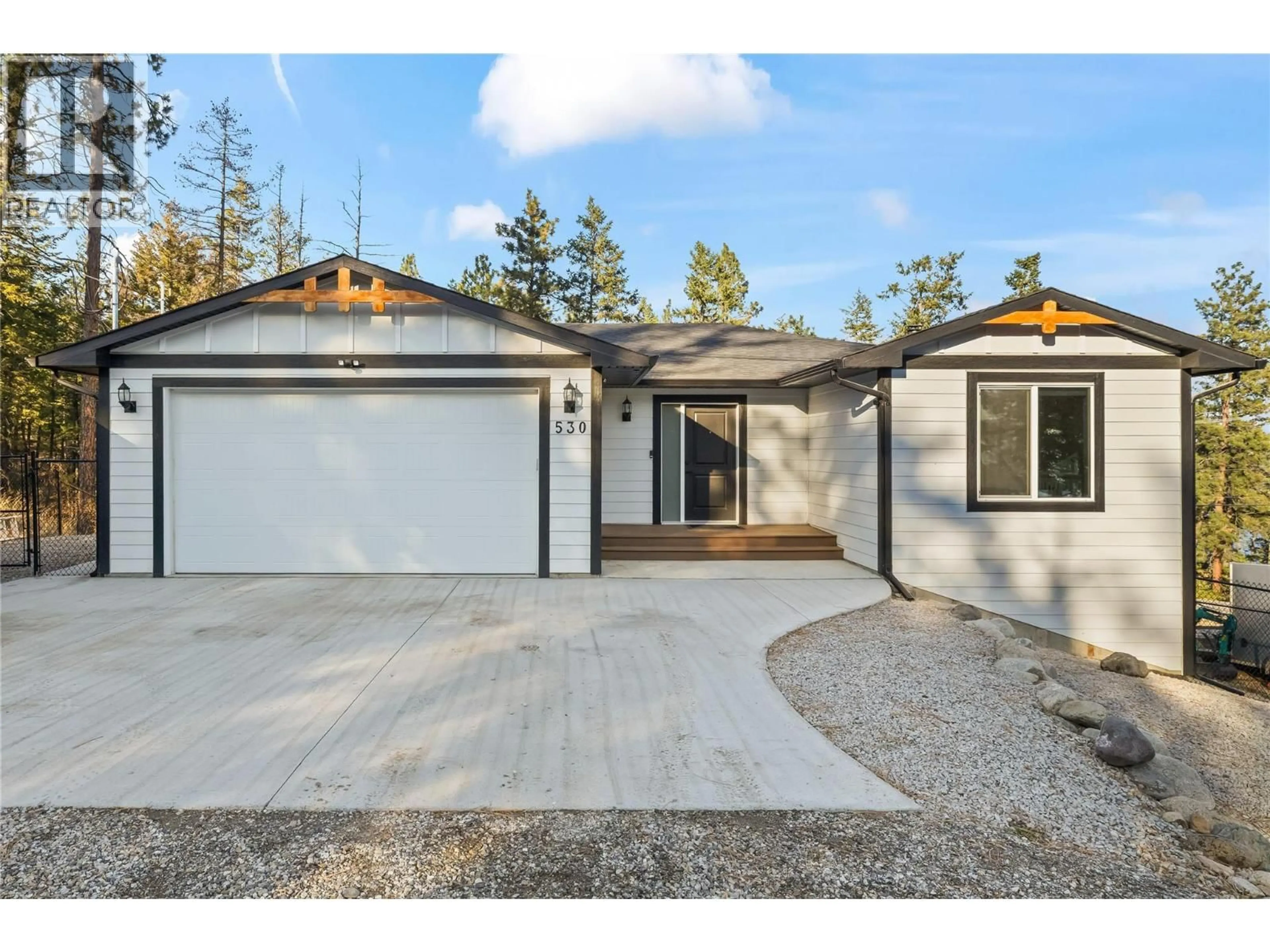 Home with vinyl exterior material, street for 530 MUIR ROAD, Fintry British Columbia V1Z3W1