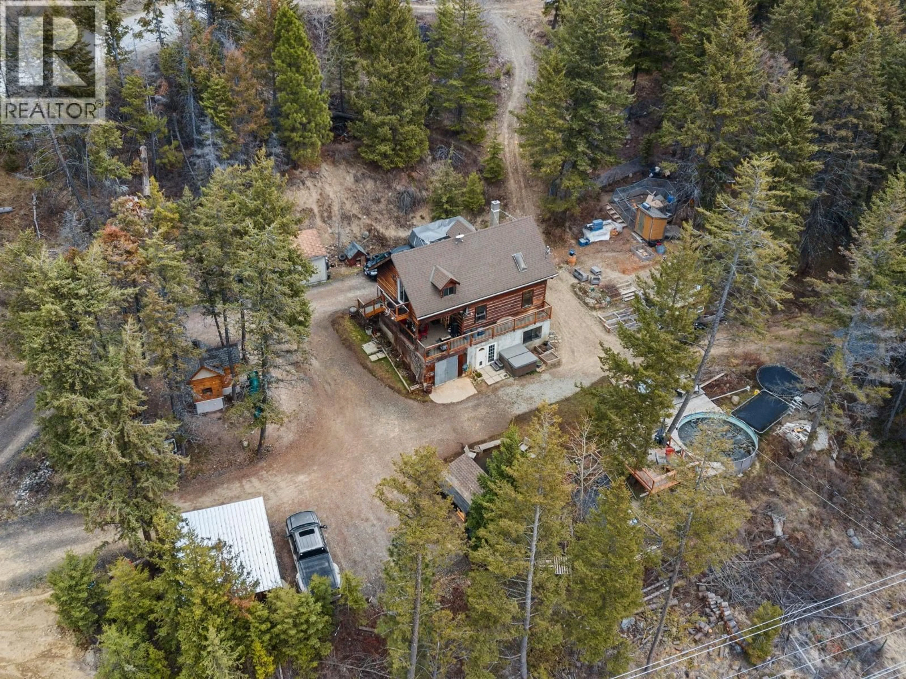 A pic from outside/outdoor area/front of a property/back of a property/a pic from drone, forest/trees view for 1809 CARDINAL CREEK ROAD, Kelowna British Columbia V1P1J3