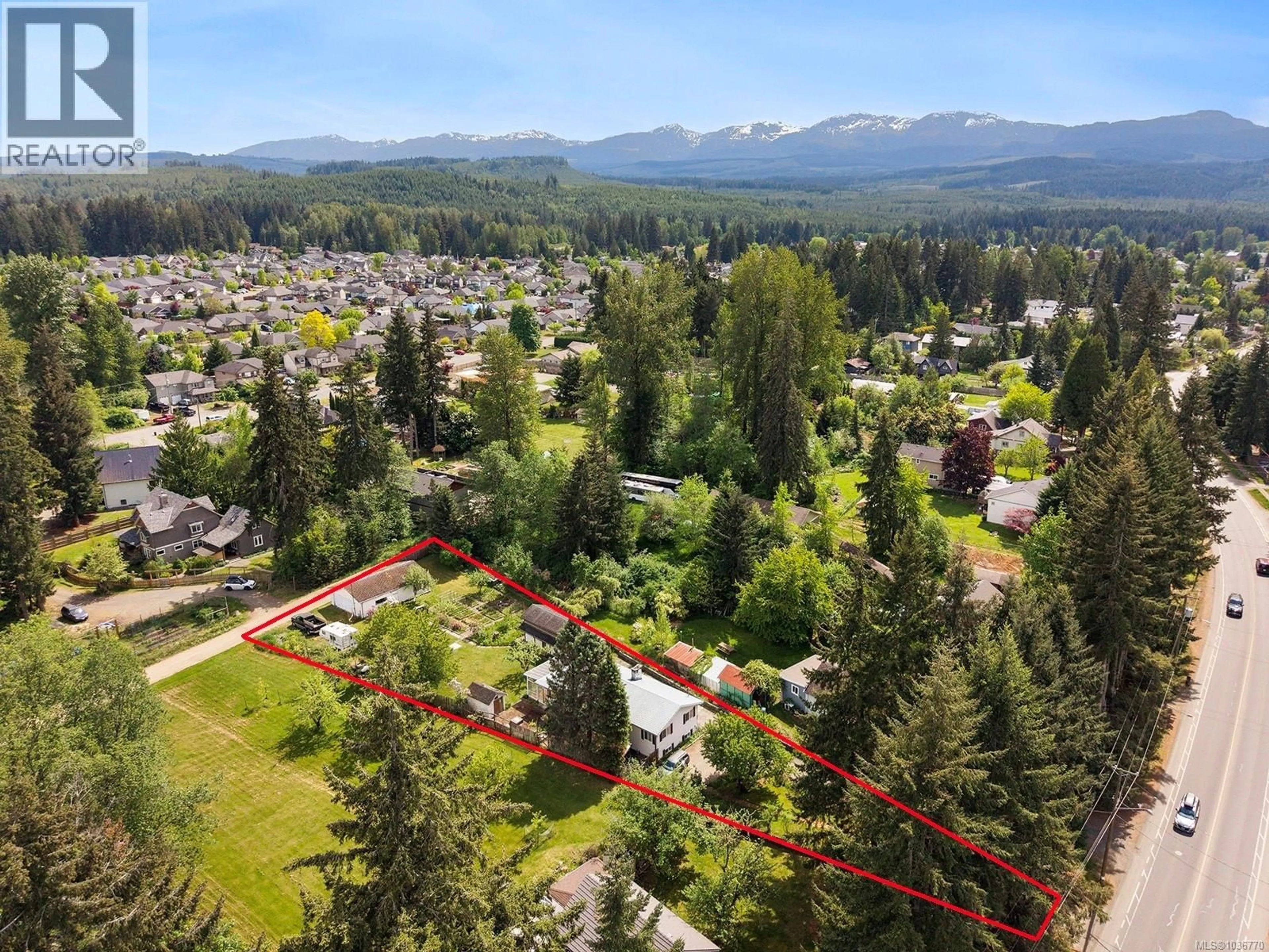 A pic from outside/outdoor area/front of a property/back of a property/a pic from drone, mountain view for 4659 CUMBERLAND ROAD, Cumberland British Columbia V0R1S0