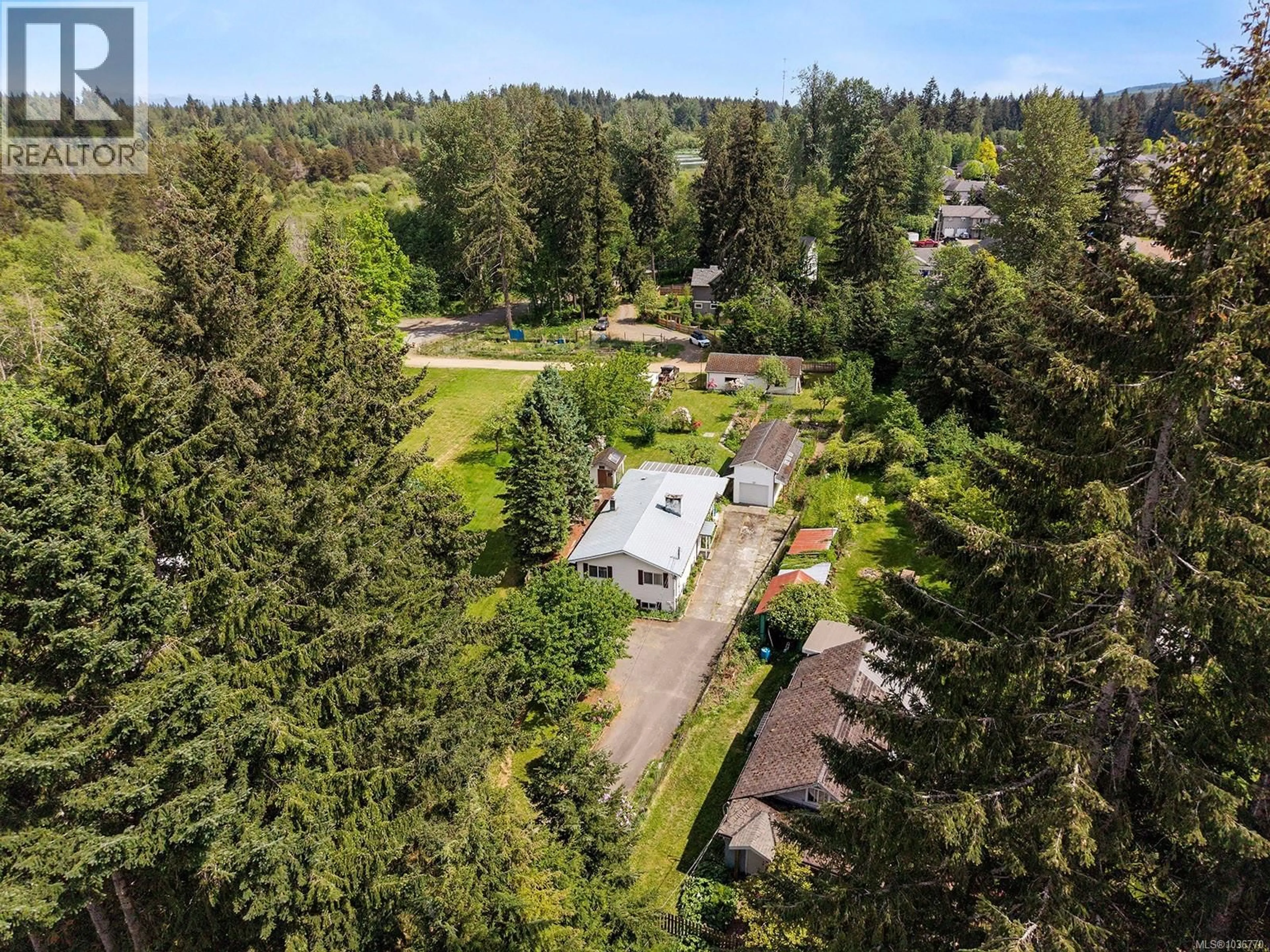 A pic from outside/outdoor area/front of a property/back of a property/a pic from drone, forest/trees view for 4659 CUMBERLAND ROAD, Cumberland British Columbia V0R1S0