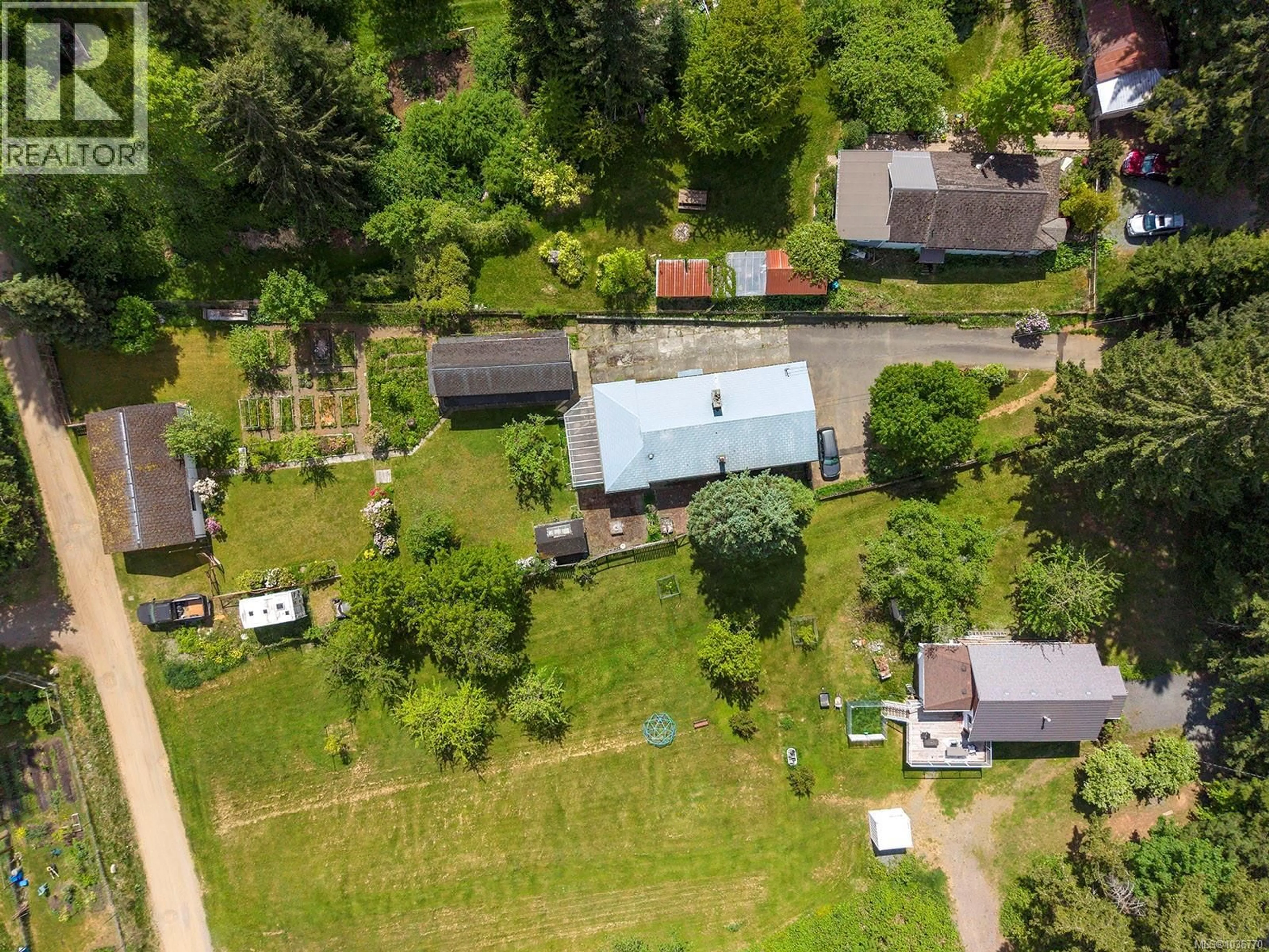 A pic from outside/outdoor area/front of a property/back of a property/a pic from drone, unknown for 4659 CUMBERLAND ROAD, Cumberland British Columbia V0R1S0