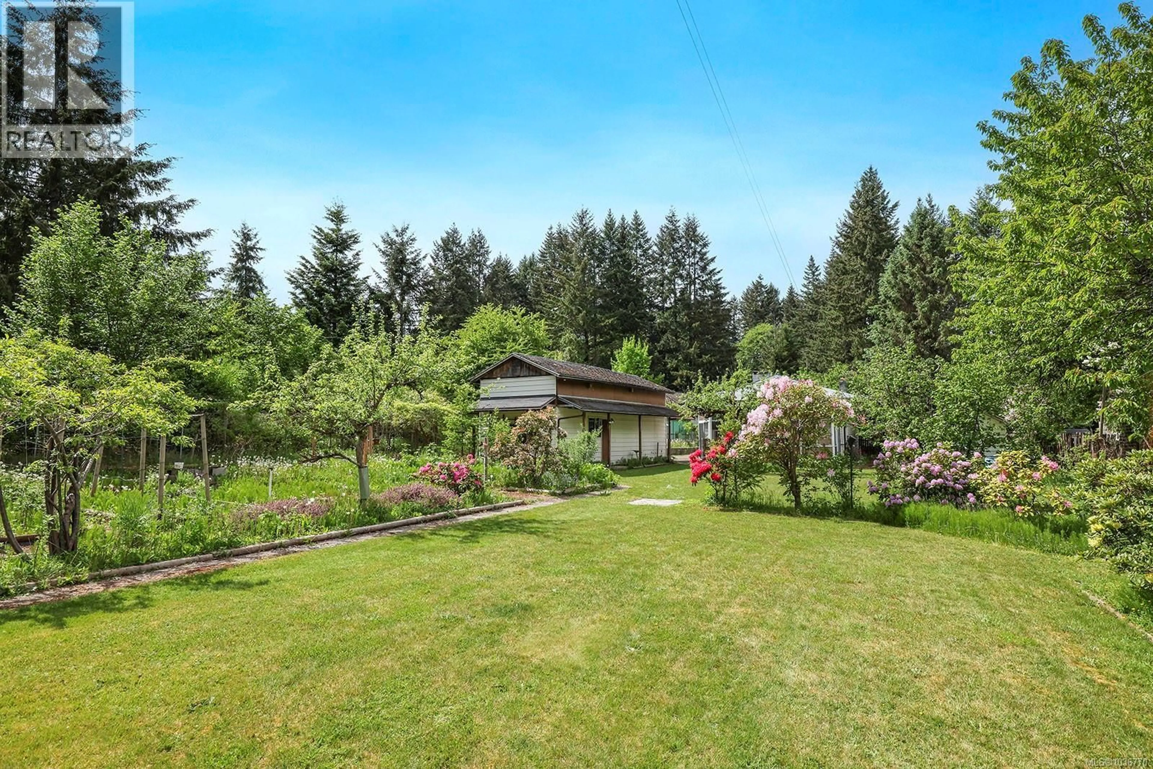 A pic from outside/outdoor area/front of a property/back of a property/a pic from drone, unknown for 4659 CUMBERLAND ROAD, Cumberland British Columbia V0R1S0