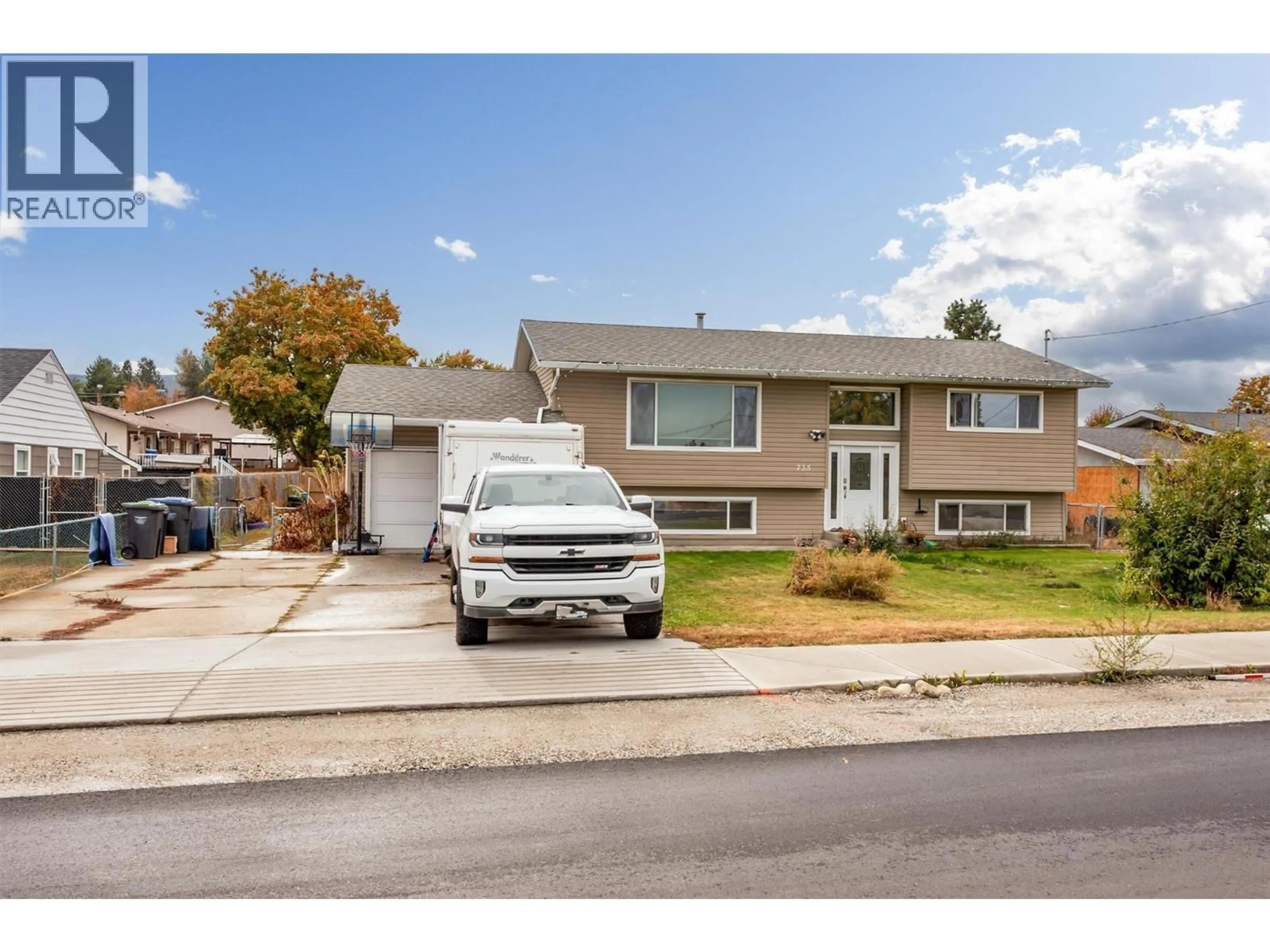 Home with vinyl exterior material, street for 735 BELGO ROAD, Kelowna British Columbia V1X3A6