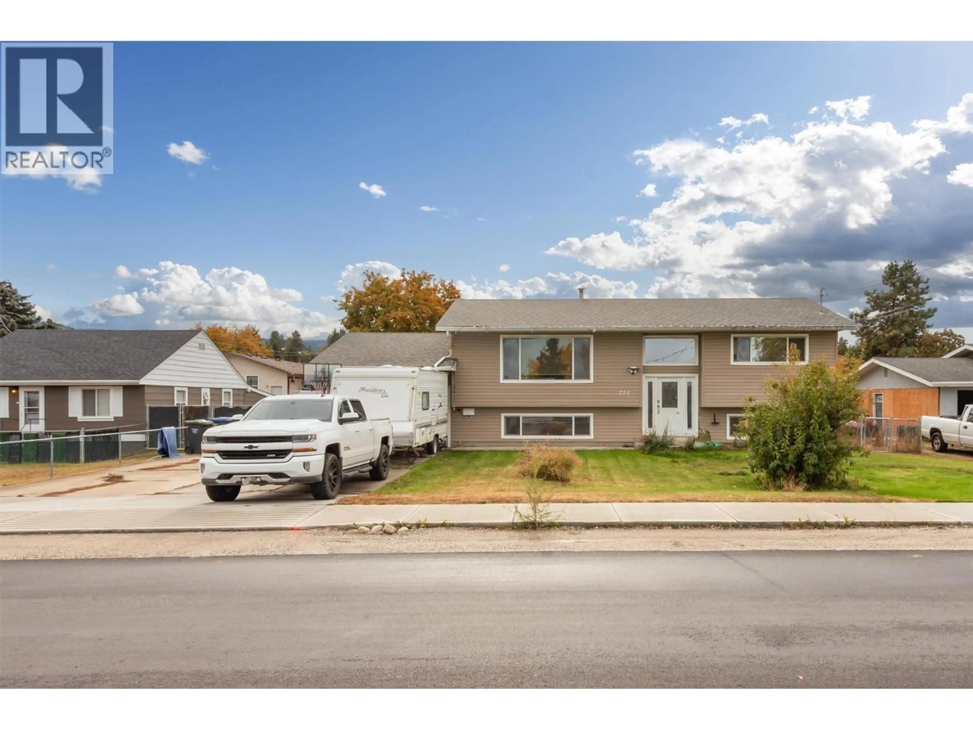 Home with vinyl exterior material, street for 735 BELGO ROAD, Kelowna British Columbia V1X3A6