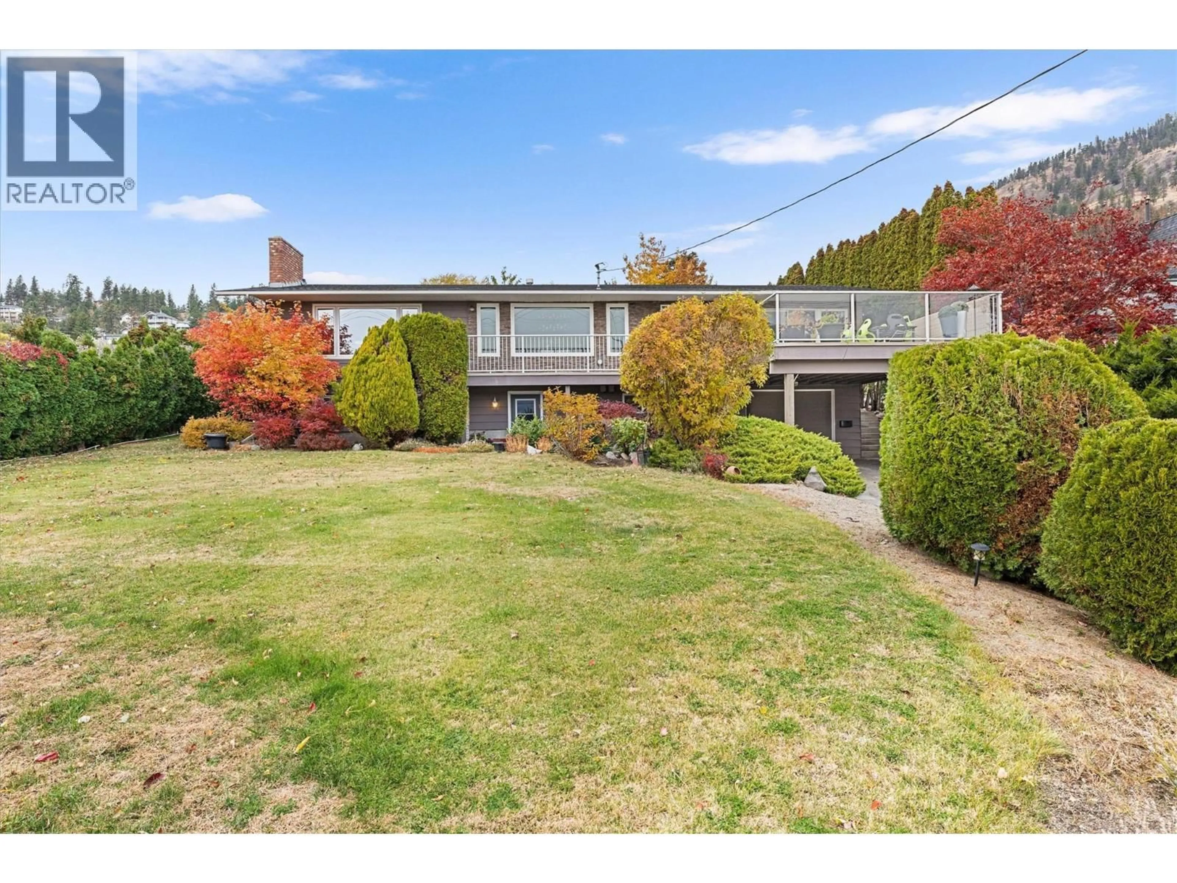 A pic from outside/outdoor area/front of a property/back of a property/a pic from drone, street for 5524 BUCHANAN ROAD, Peachland British Columbia V0H1X1