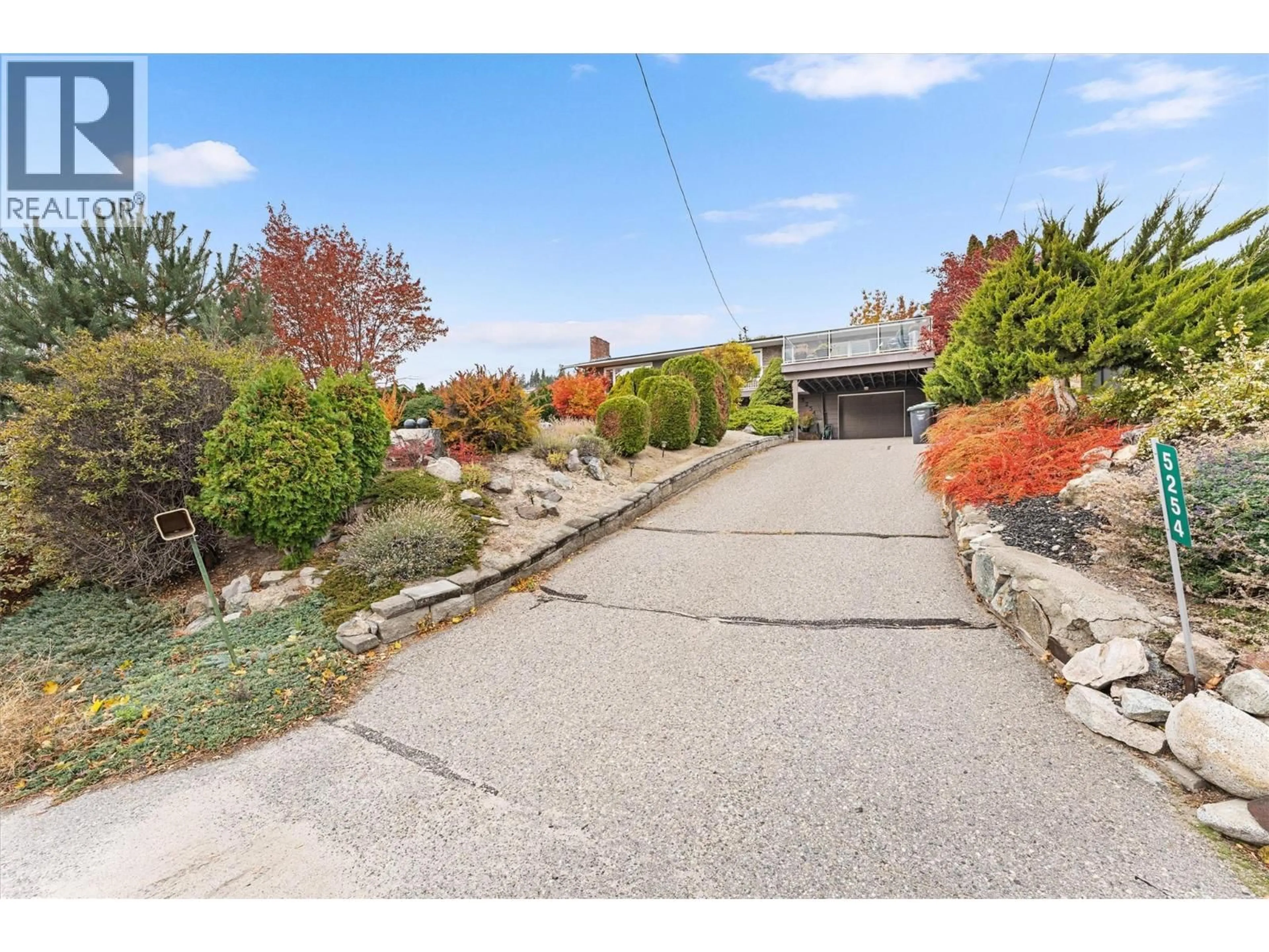 A pic from outside/outdoor area/front of a property/back of a property/a pic from drone, street for 5524 BUCHANAN ROAD, Peachland British Columbia V0H1X1