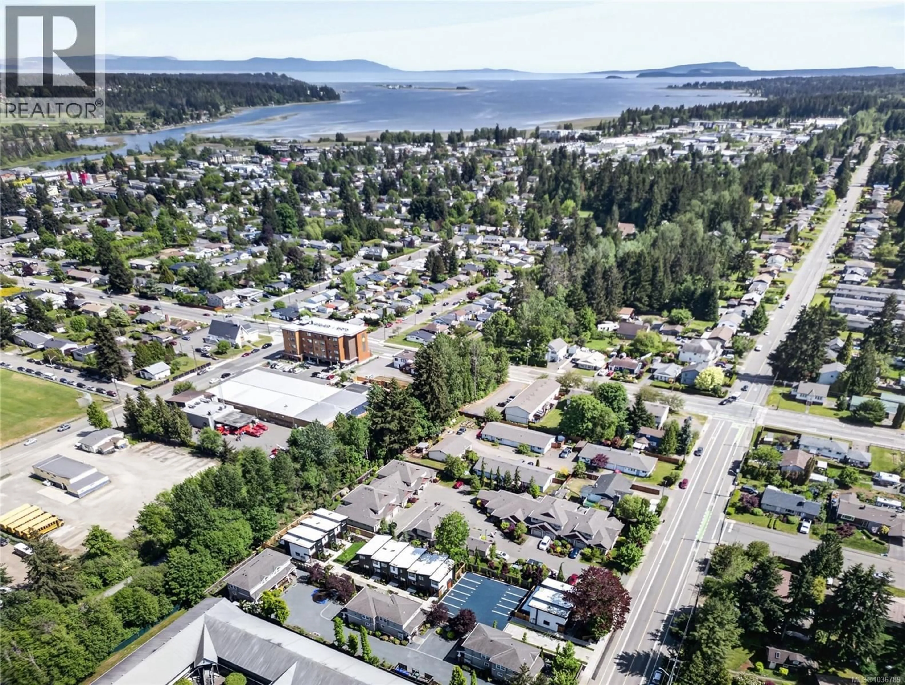 A pic from outside/outdoor area/front of a property/back of a property/a pic from drone, street for 1 - 1590 PIERCY AVENUE, Courtenay British Columbia V9N3E9
