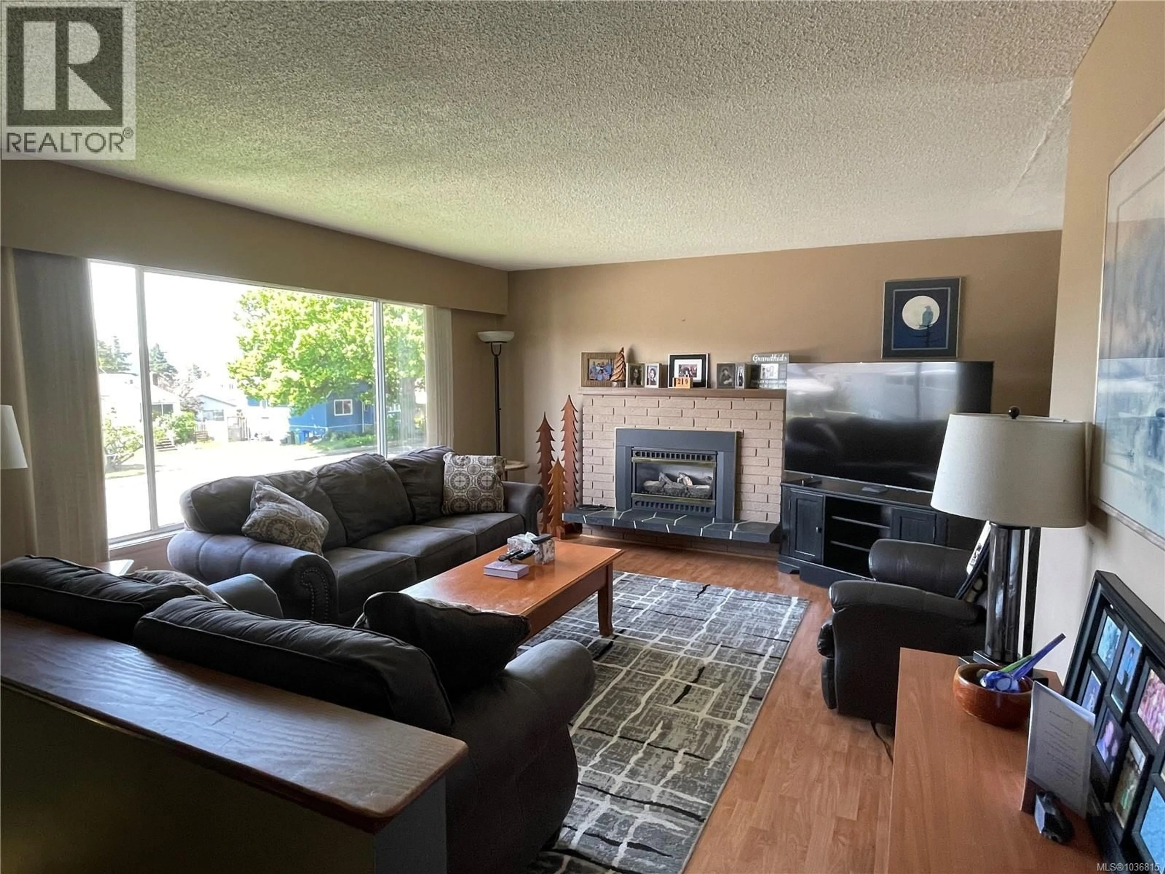 Living room with furniture, wood/laminate floor for 2617 10TH AVENUE, Port Alberni British Columbia V9Y2P2