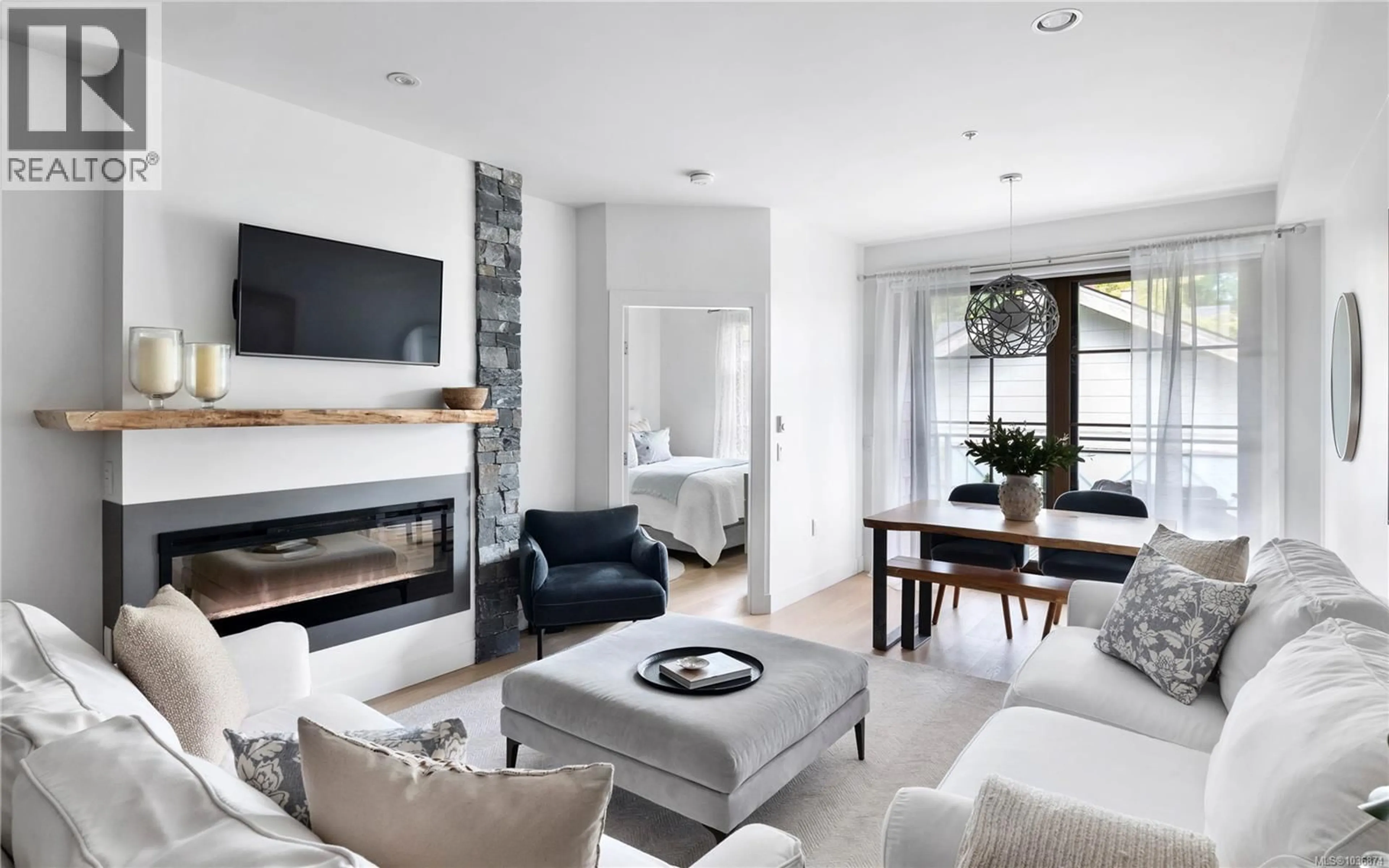 Living room with furniture, unknown for 202 - 2580 PENRHYN STREET, Saanich British Columbia V8N1G3