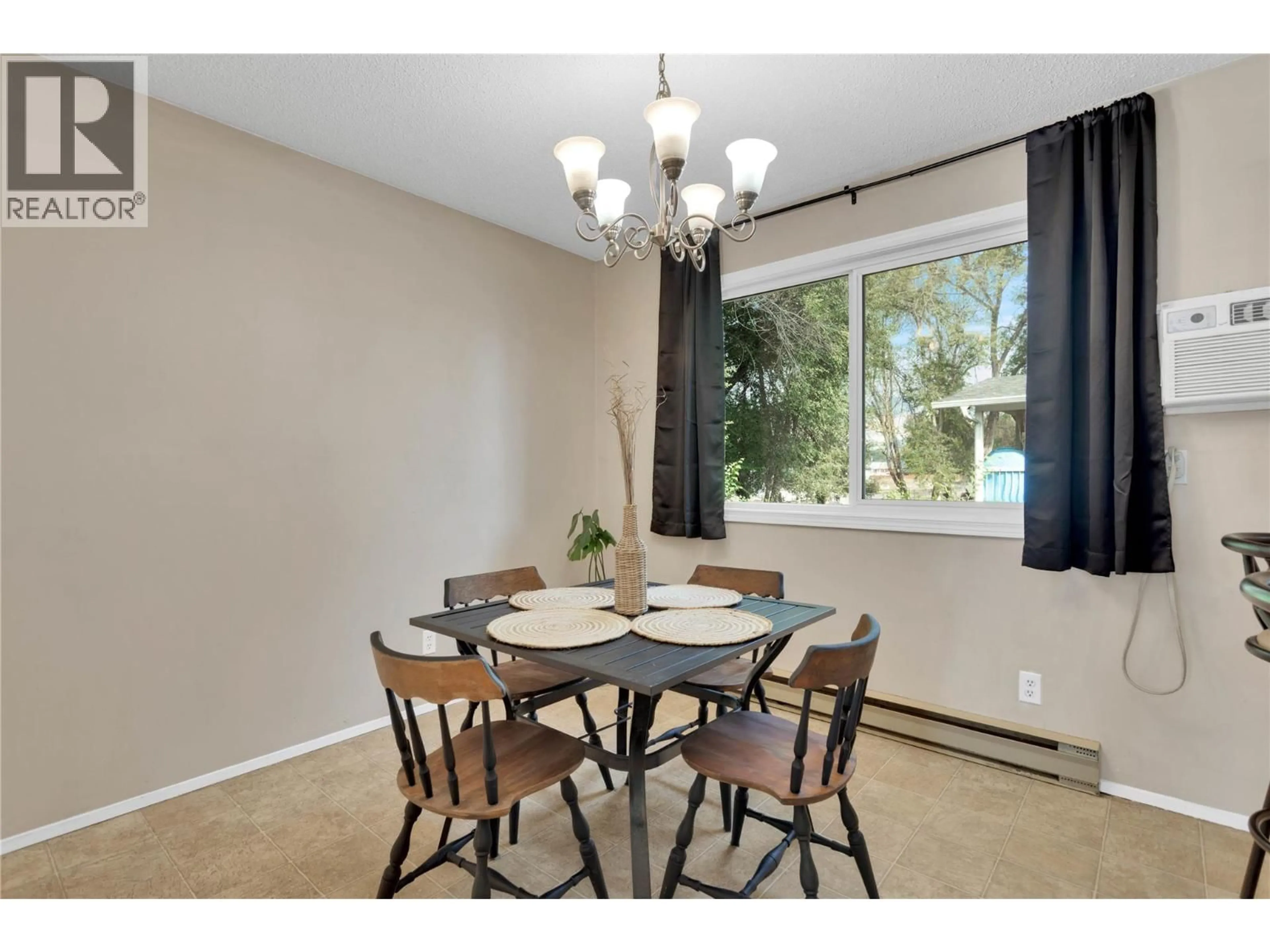 Dining room, wood/laminate floor for 588 MCCURDY ROAD, Kelowna British Columbia V1X2P5