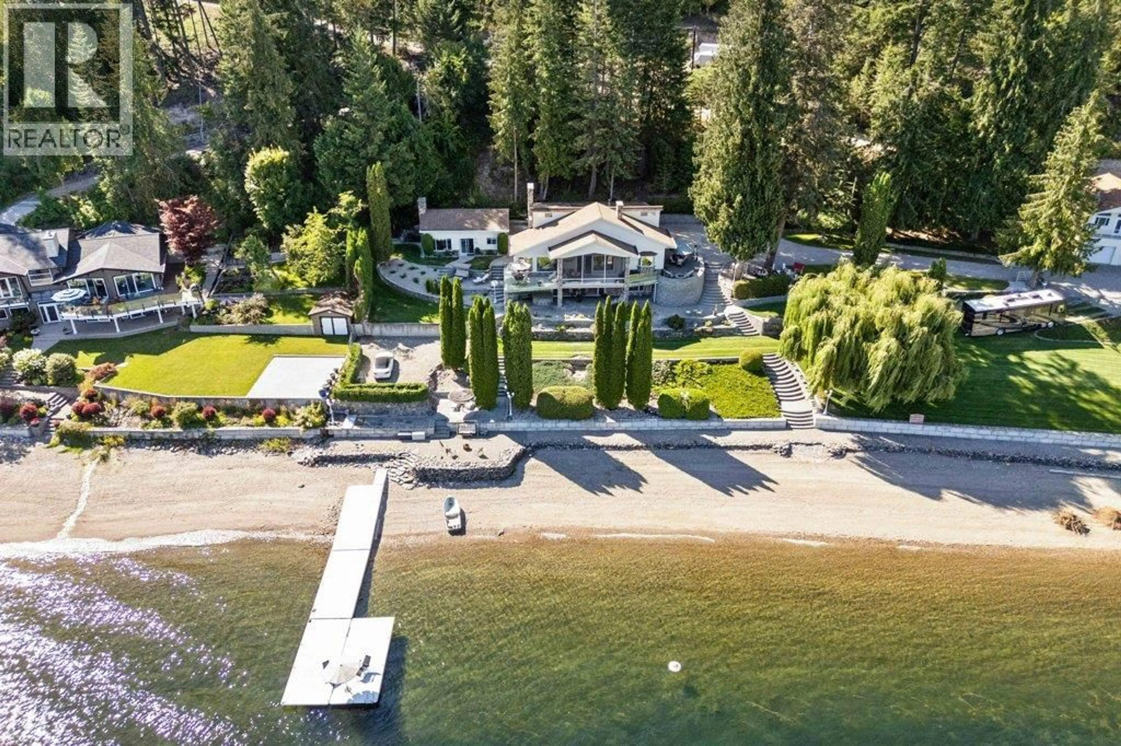 A pic from outside/outdoor area/front of a property/back of a property/a pic from drone, water/lake/river/ocean view for 4842 SUNNYBRAE CANOE POINT ROAD, Tappen British Columbia V0E2X1