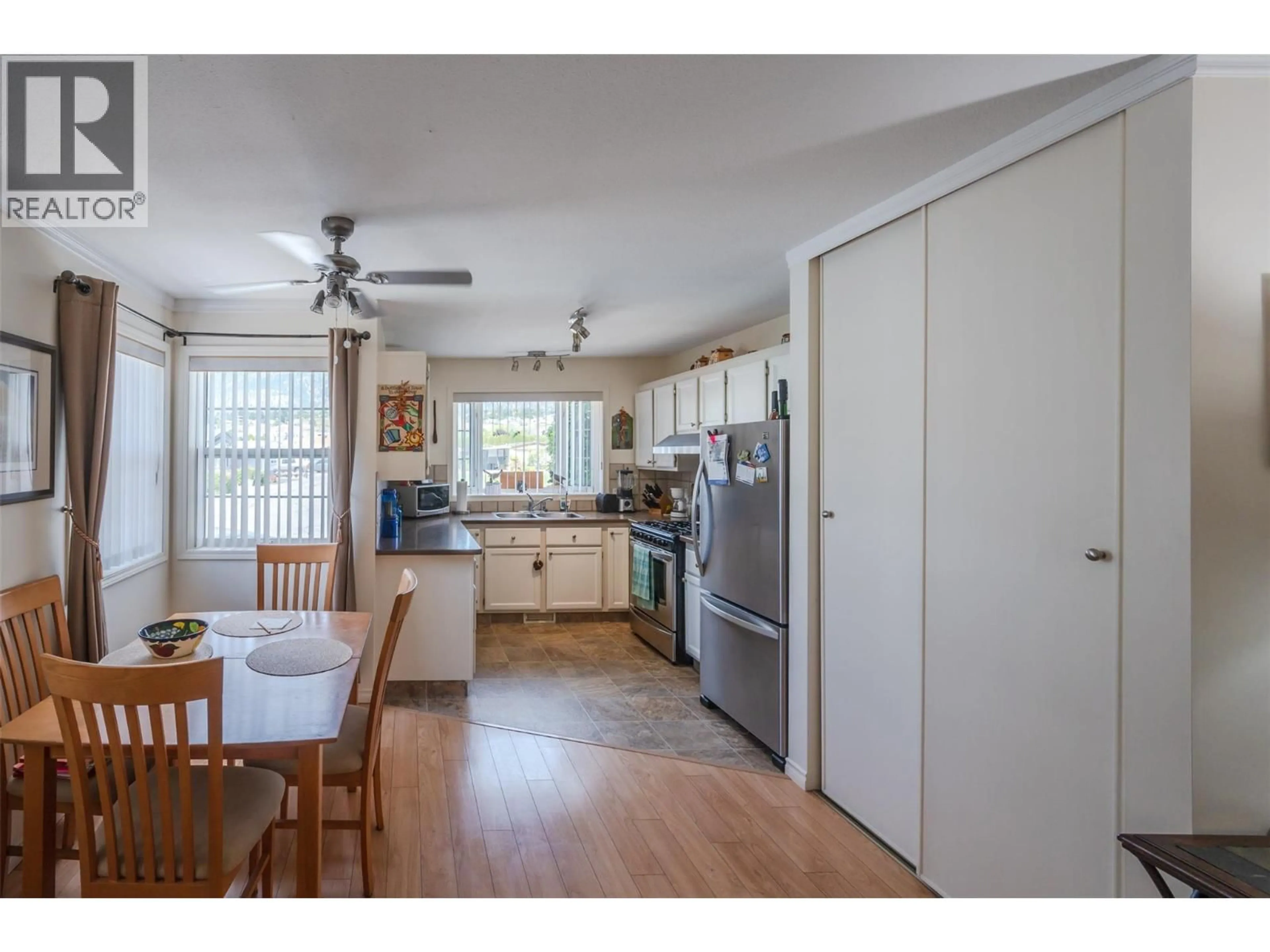 Open concept kitchen, wood/laminate floor for 54 - 999 BURNABY AVENUE, Penticton British Columbia V2A1G7