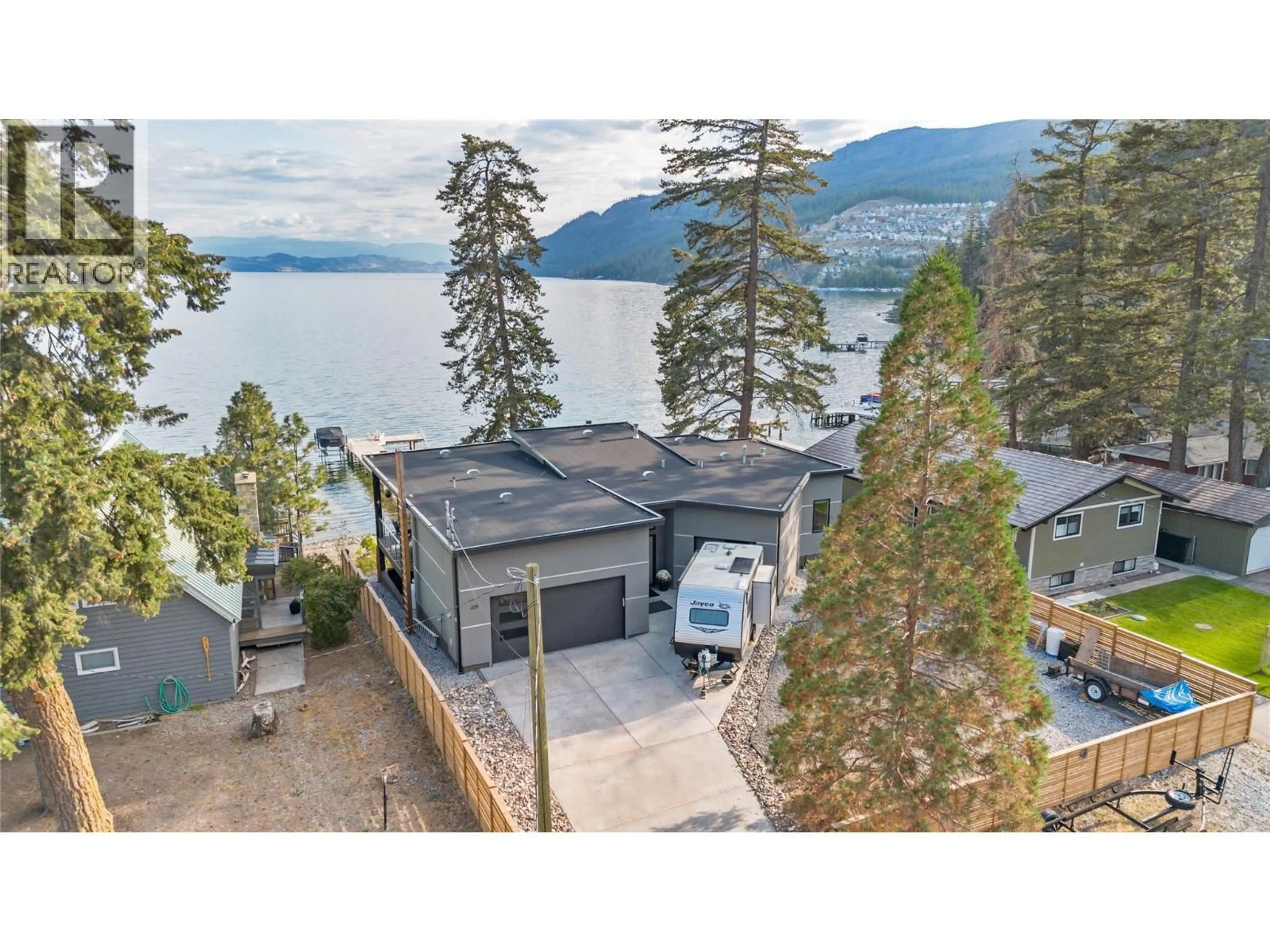 A pic from outside/outdoor area/front of a property/back of a property/a pic from drone, water/lake/river/ocean view for 419 SHORTS ROAD, Fintry British Columbia V1Z3T9