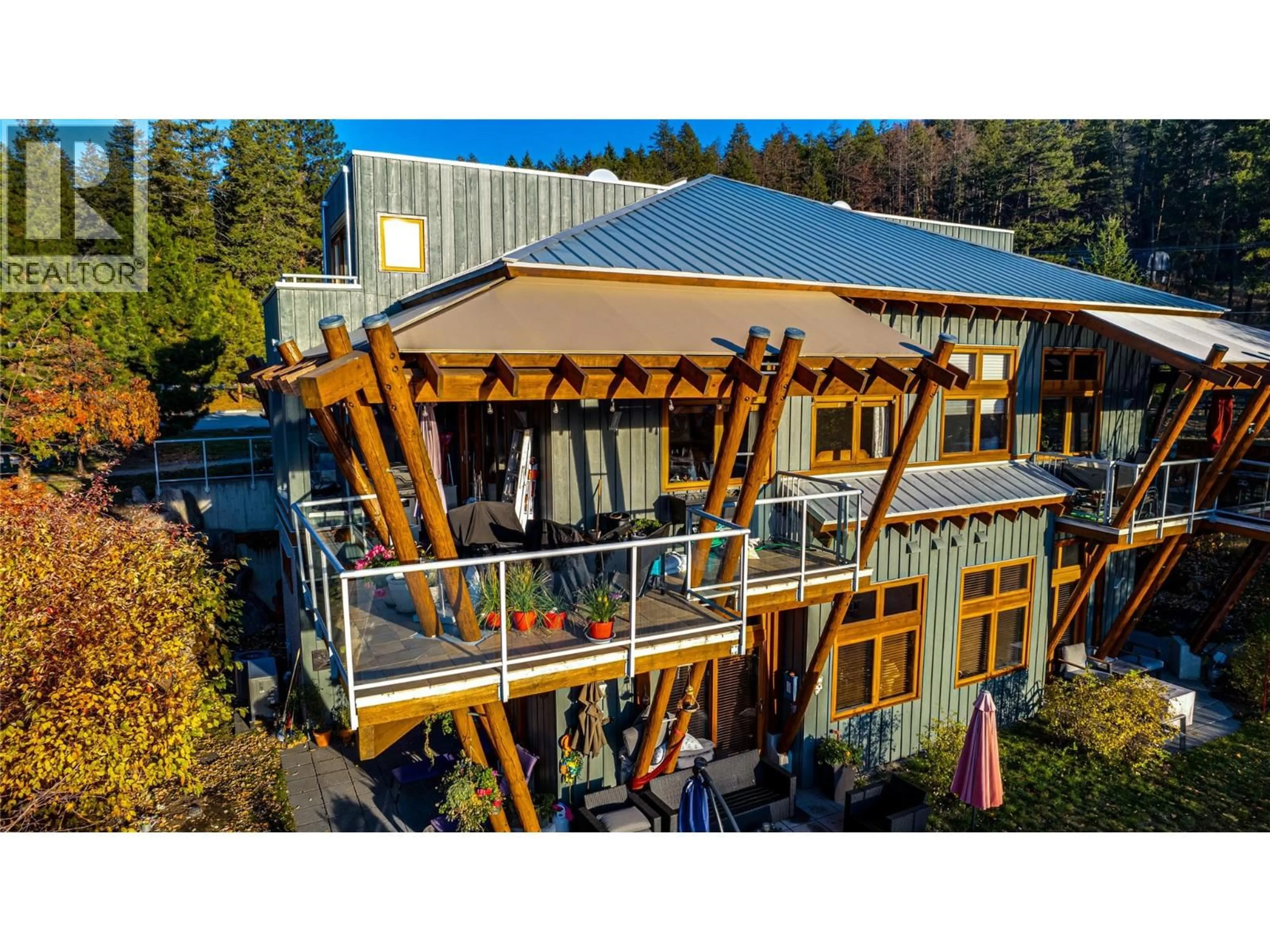 A pic from outside/outdoor area/front of a property/back of a property/a pic from drone, building for 79 - 9845 EASTSIDE ROAD, Vernon British Columbia V1H1Z2
