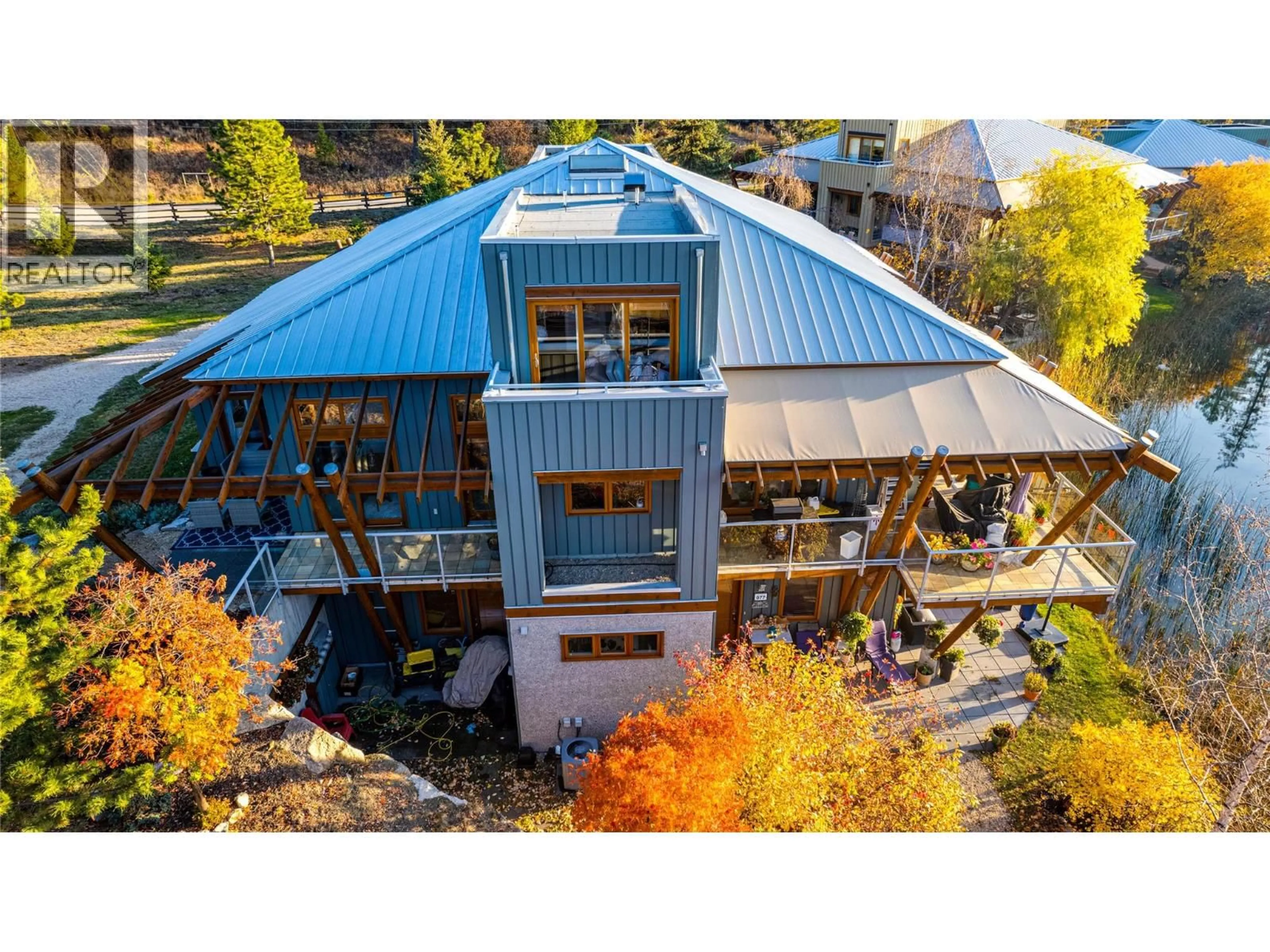 A pic from outside/outdoor area/front of a property/back of a property/a pic from drone, building for 79 - 9845 EASTSIDE ROAD, Vernon British Columbia V1H1Z2