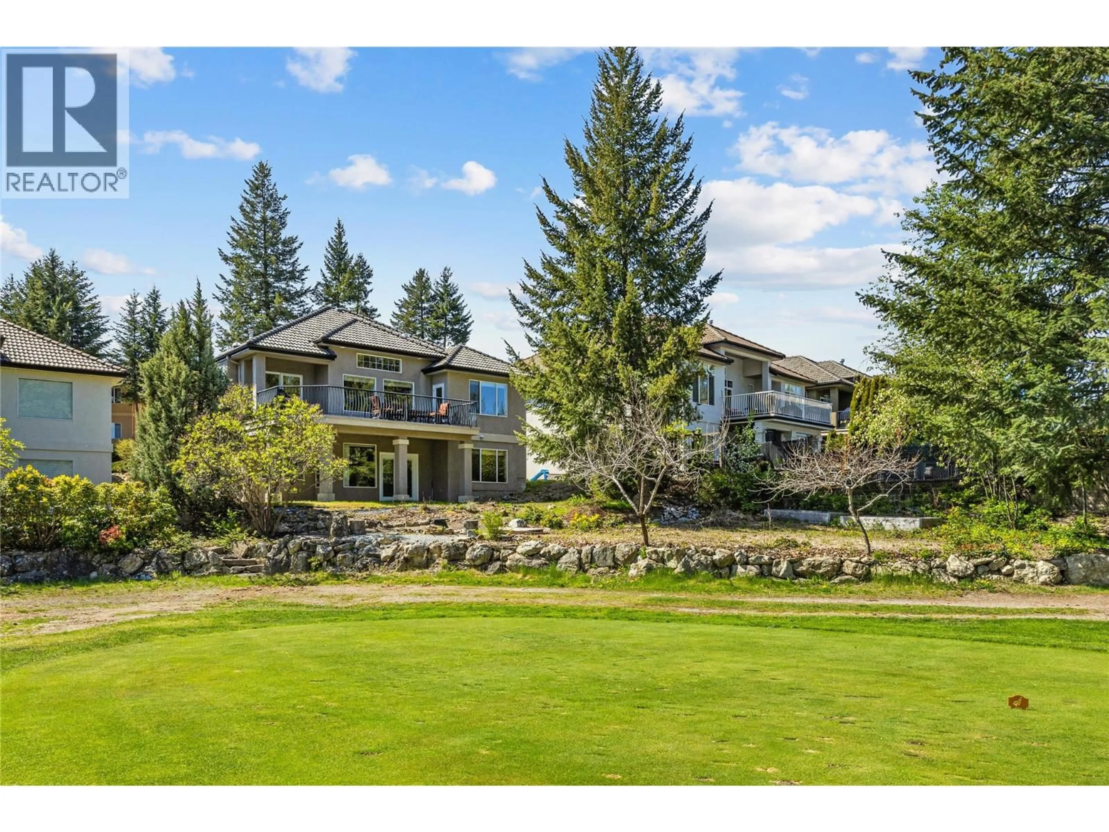 A pic from outside/outdoor area/front of a property/back of a property/a pic from drone, mountain view for 103 - 1950 CAPISTRANO DRIVE, Kelowna British Columbia V1V2N7