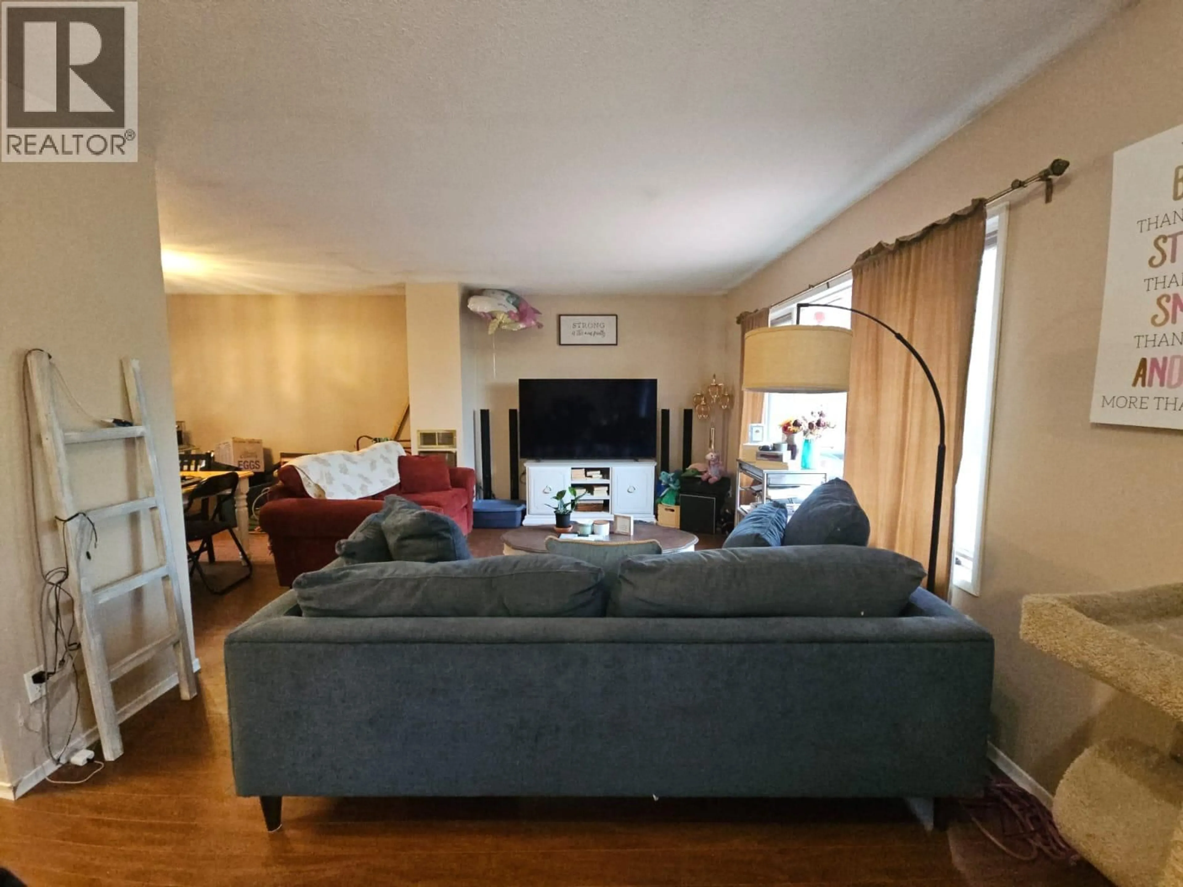 Living room with furniture, wood/laminate floor for 6327 WILDMARE SUB OTHER, Chetwynd British Columbia V0C1J0