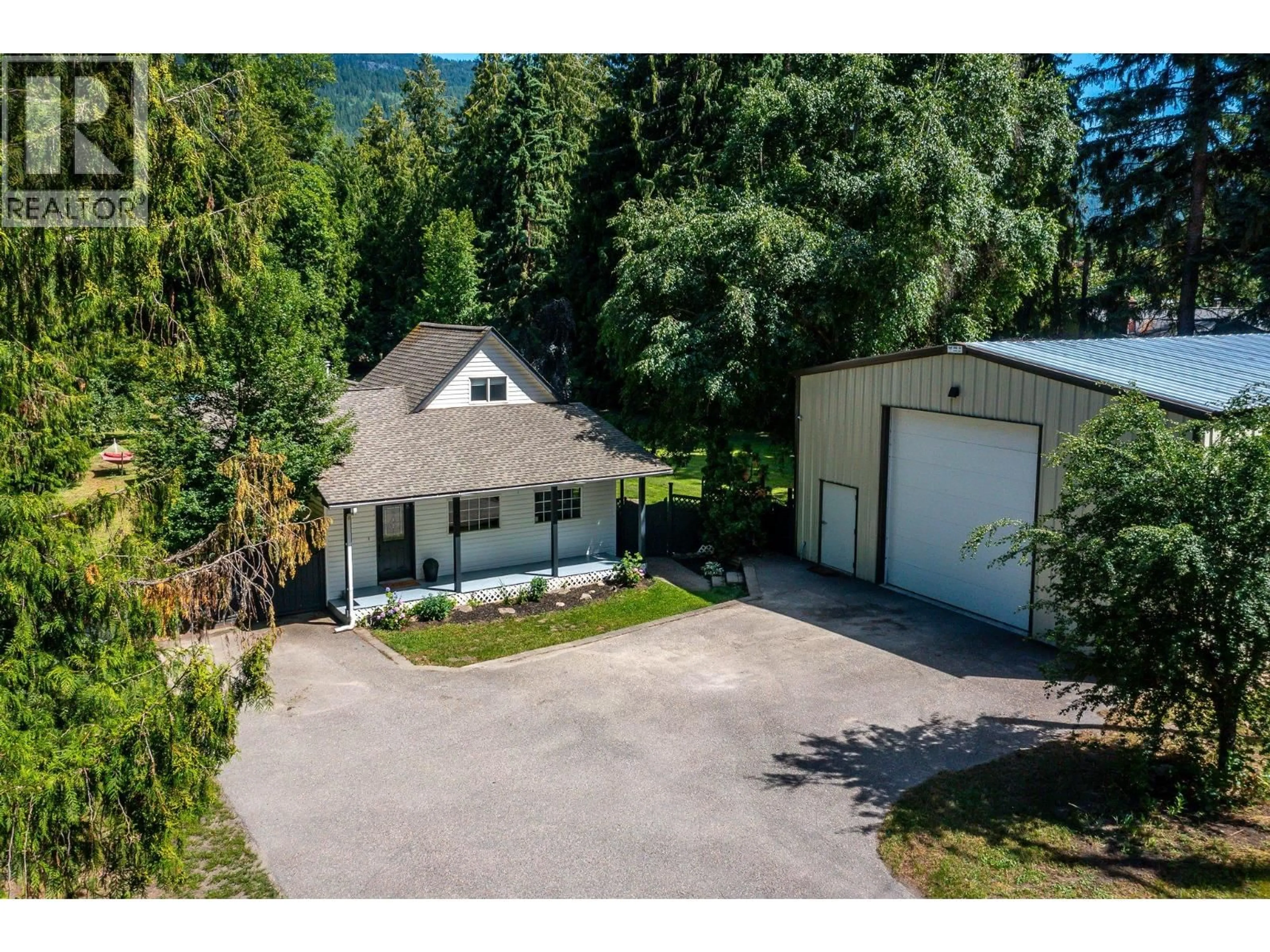 A pic from outside/outdoor area/front of a property/back of a property/a pic from drone, mountain view for 855 SALMON RIVER ROAD, Salmon Arm British Columbia V1E3G3