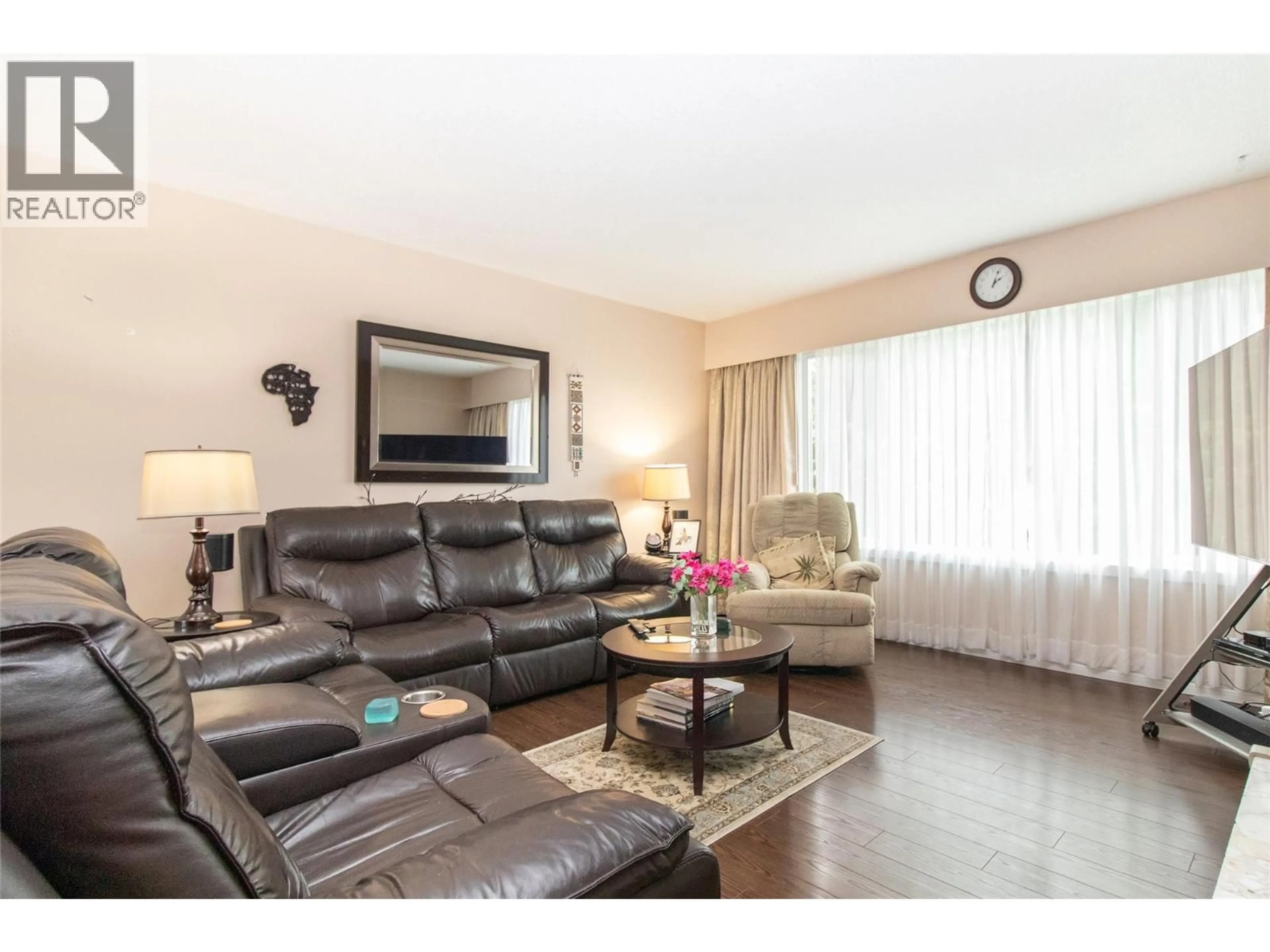 Living room with furniture, wood/laminate floor for 710 TAMARACK DRIVE, Kelowna British Columbia V1X5L9