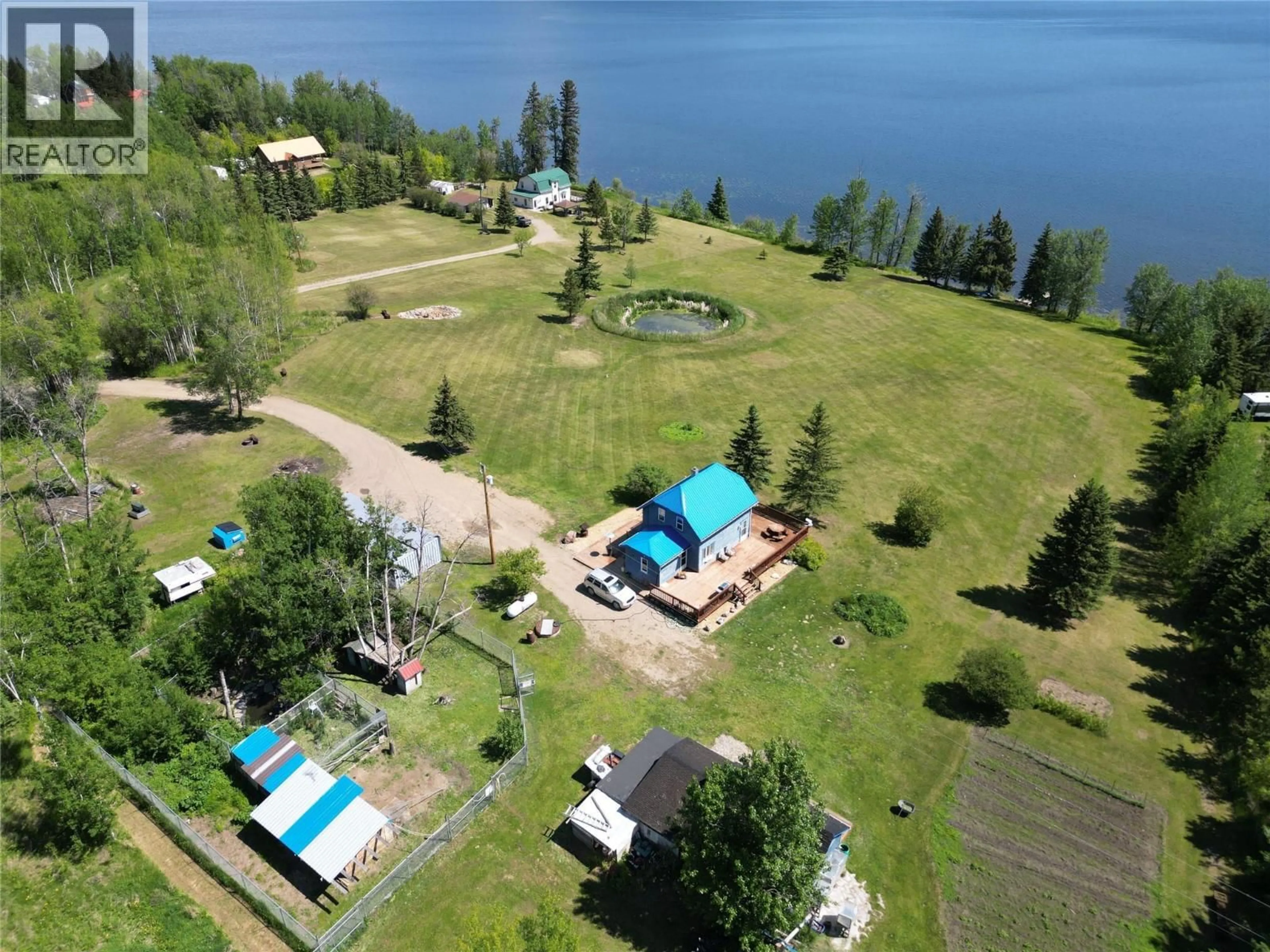 A pic from outside/outdoor area/front of a property/back of a property/a pic from drone, water/lake/river/ocean view for 16020 TUPPER VILLAGE WAY, Dawson Creek British Columbia V0C0B7
