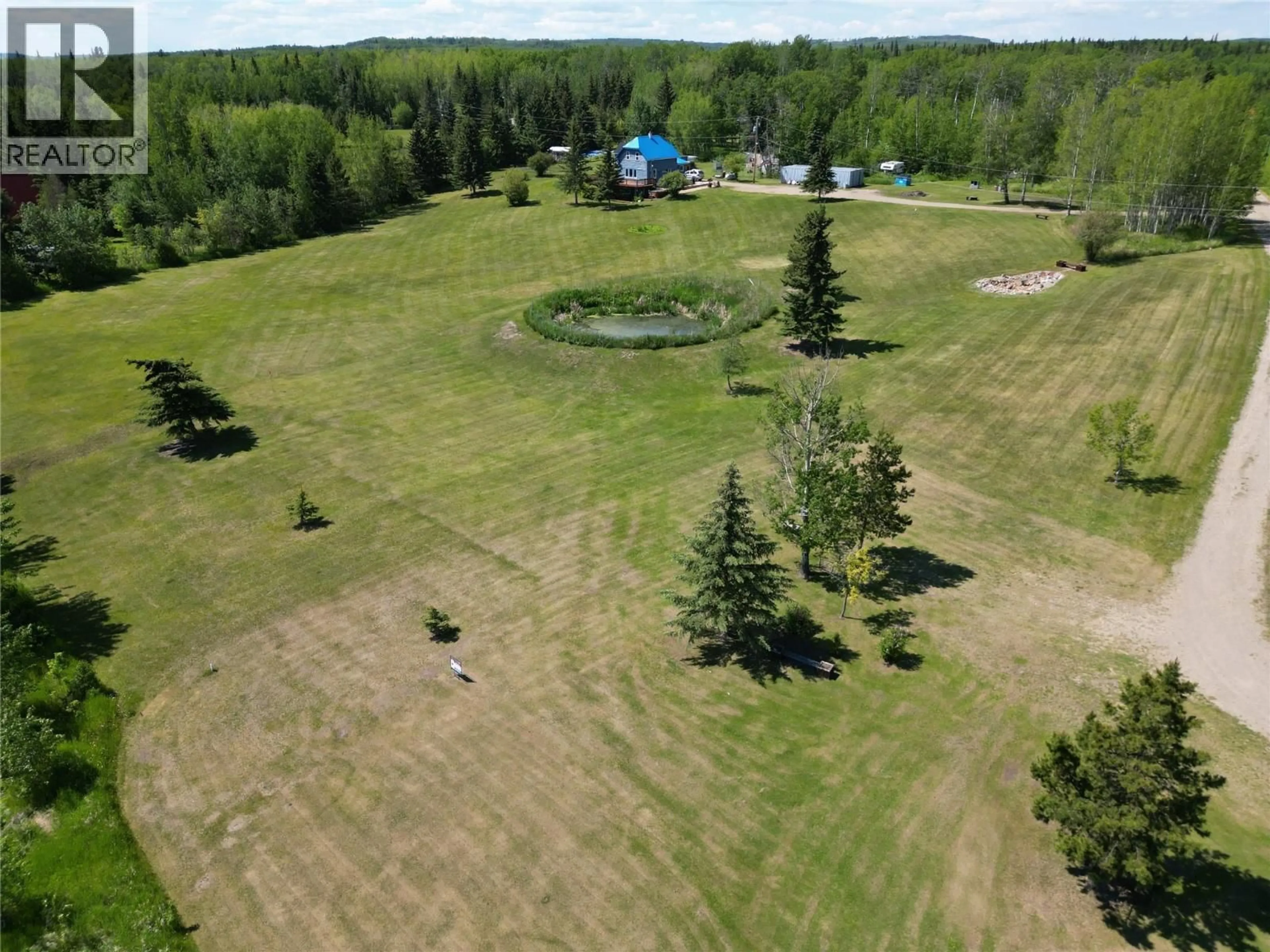 A pic from outside/outdoor area/front of a property/back of a property/a pic from drone, water/lake/river/ocean view for 16020 TUPPER VILLAGE WAY, Dawson Creek British Columbia V0C0B7