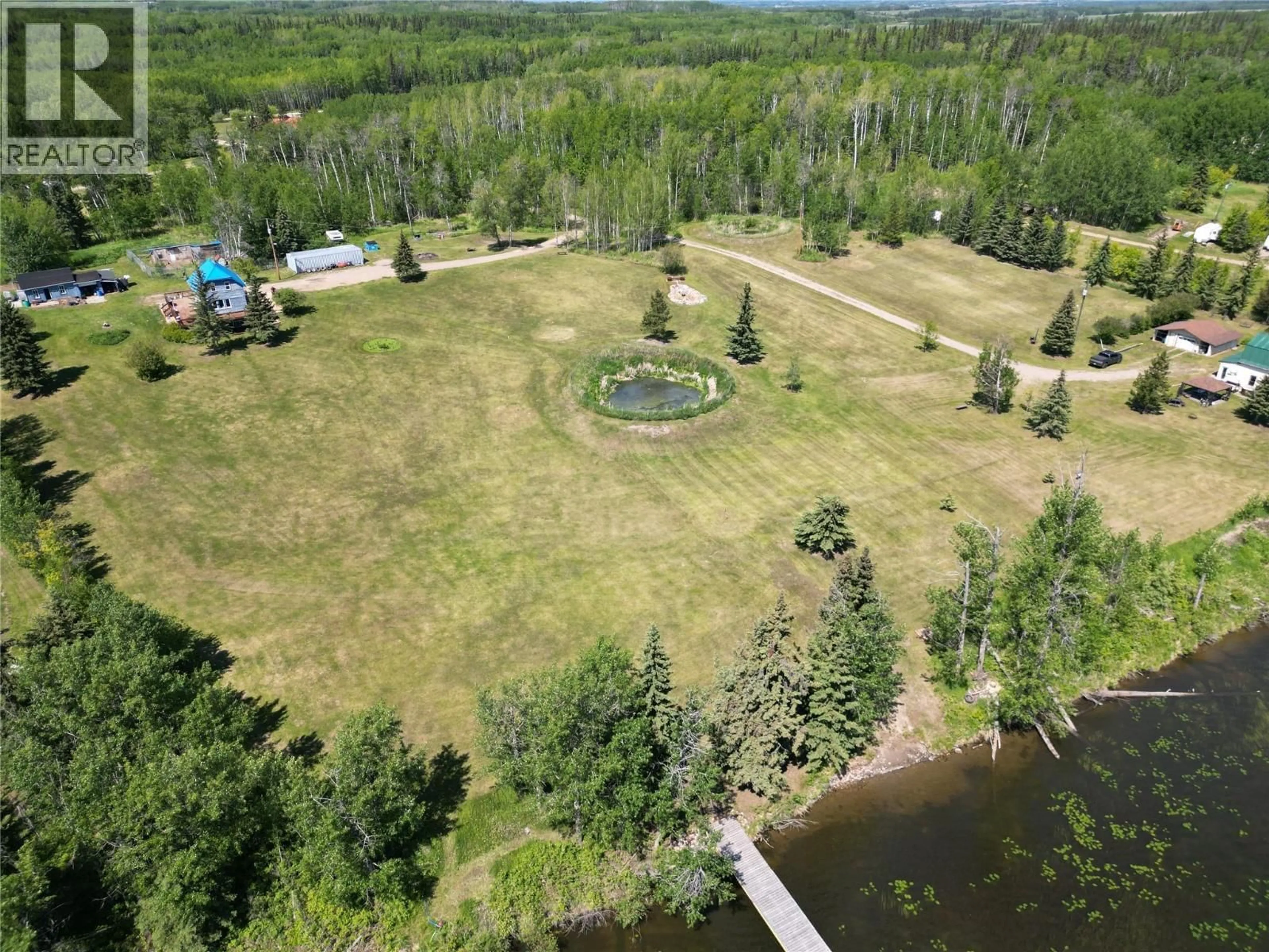 A pic from outside/outdoor area/front of a property/back of a property/a pic from drone, forest/trees view for 16020 TUPPER VILLAGE WAY, Dawson Creek British Columbia V0C0B7