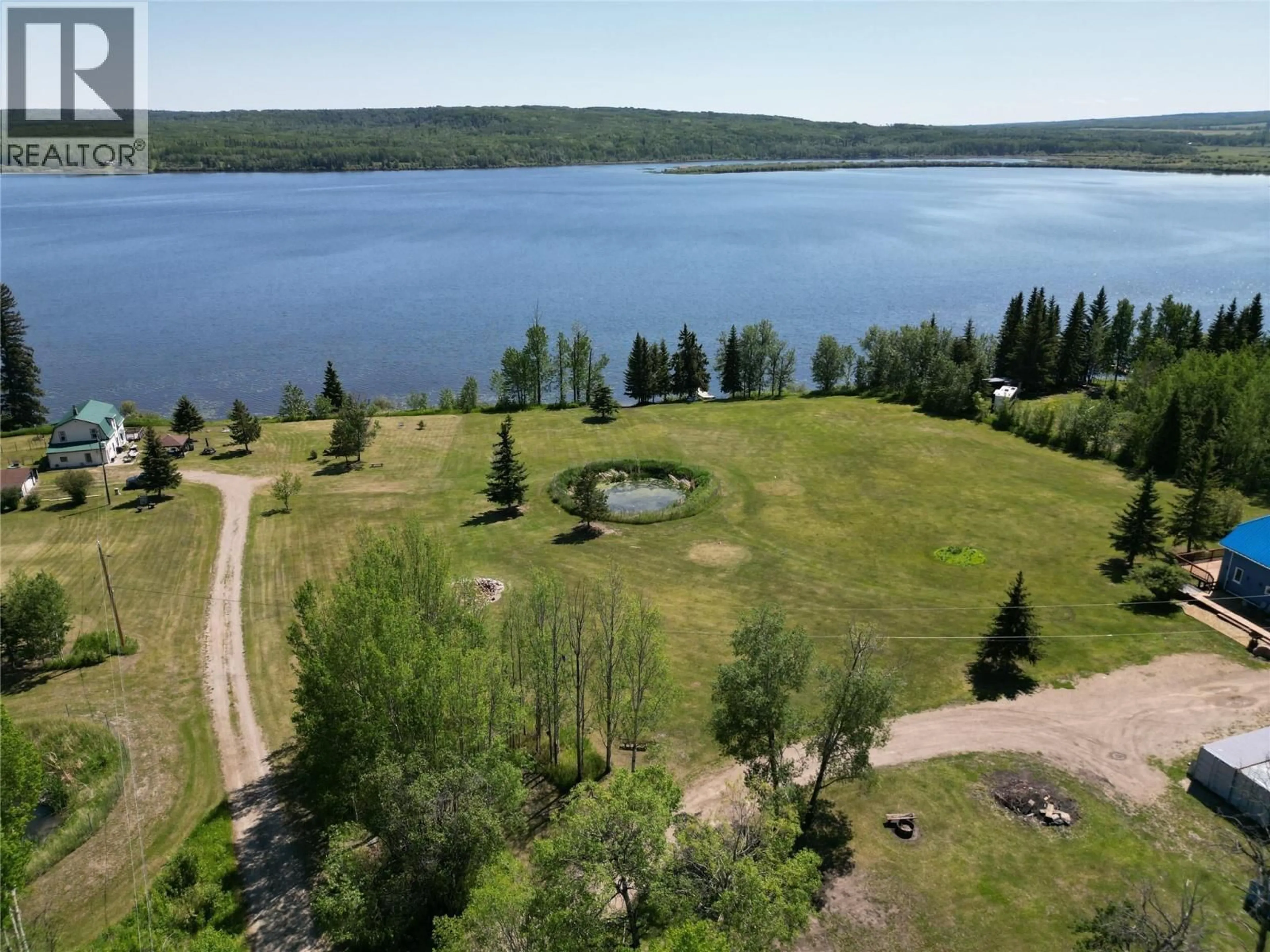 A pic from outside/outdoor area/front of a property/back of a property/a pic from drone, water/lake/river/ocean view for 16020 TUPPER VILLAGE WAY, Dawson Creek British Columbia V0C0B7