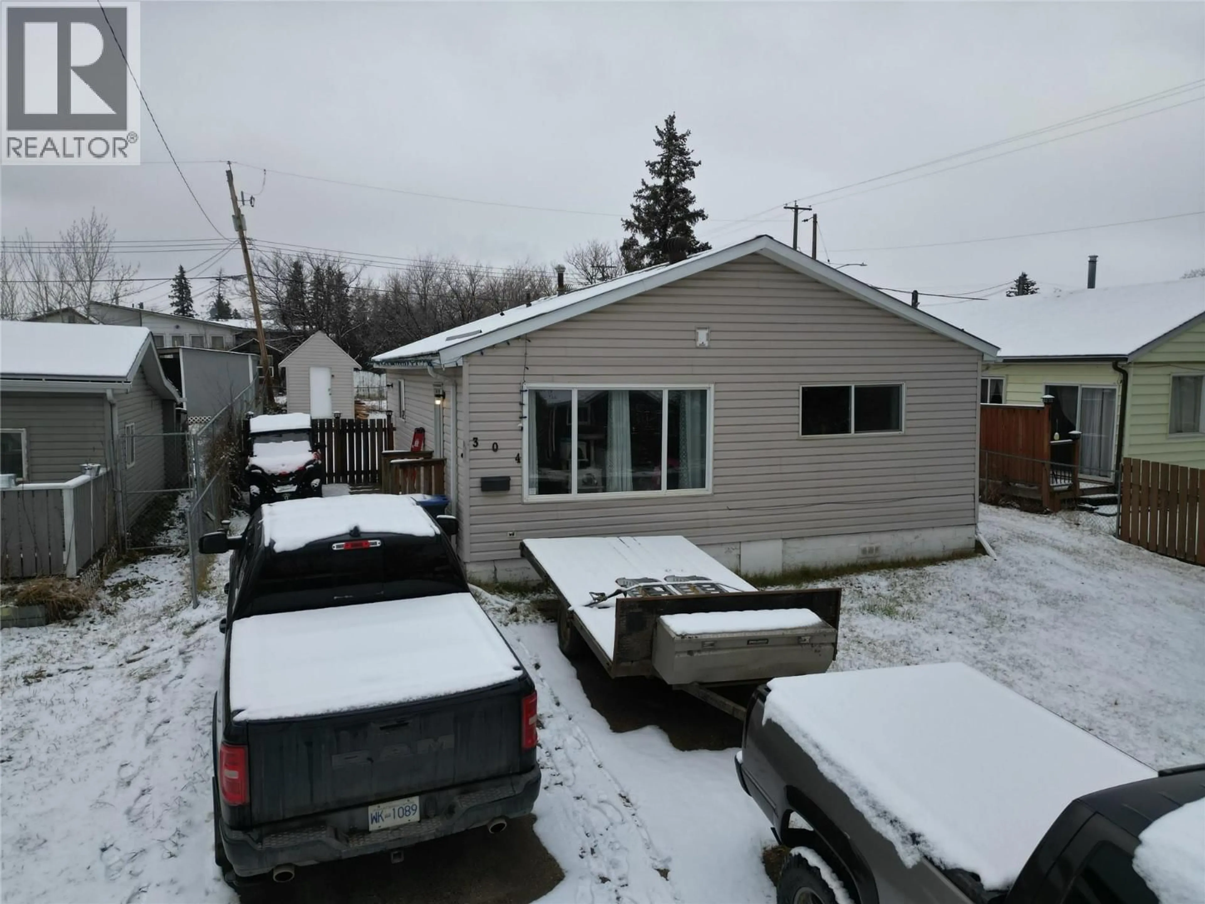 A pic from outside/outdoor area/front of a property/back of a property/a pic from drone, street for 304 100A AVENUE, Dawson Creek British Columbia V1G1X4