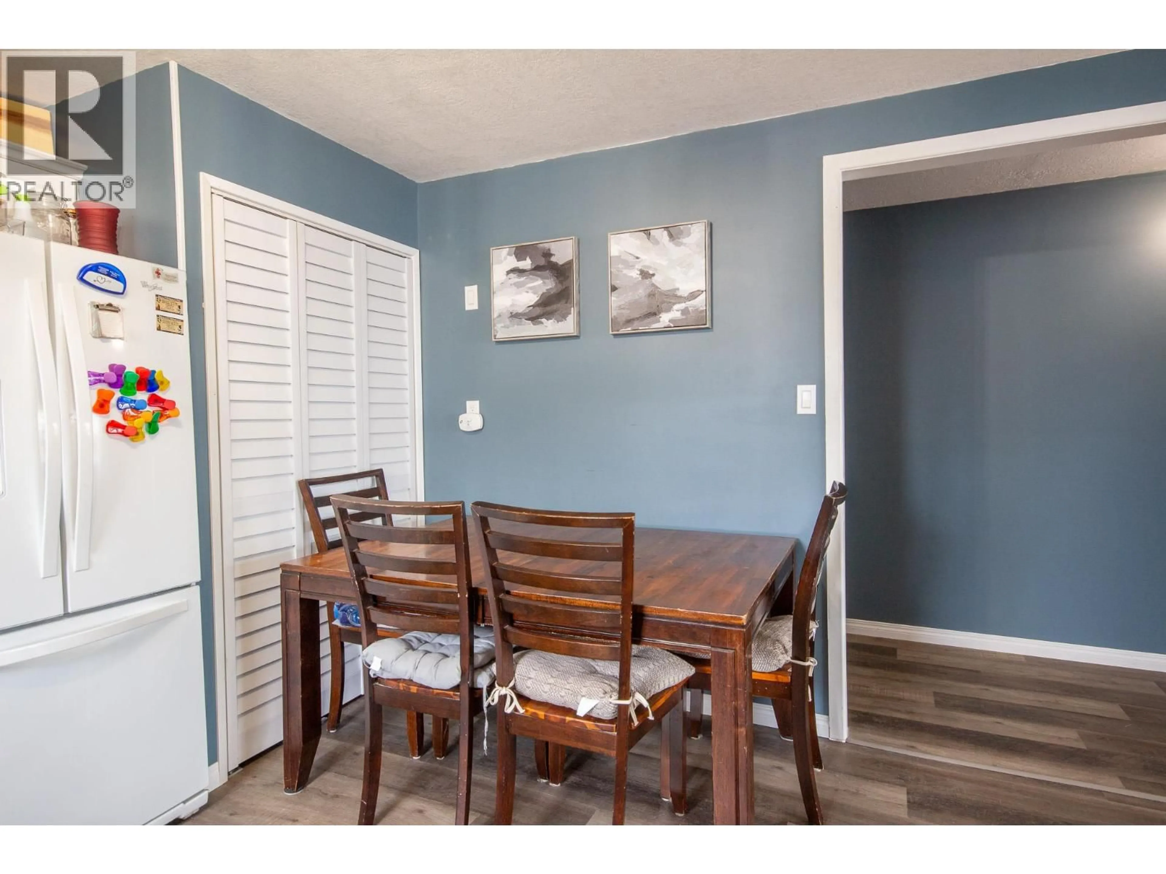 Dining room, wood/laminate floor for 304 100A AVENUE, Dawson Creek British Columbia V1G1X4