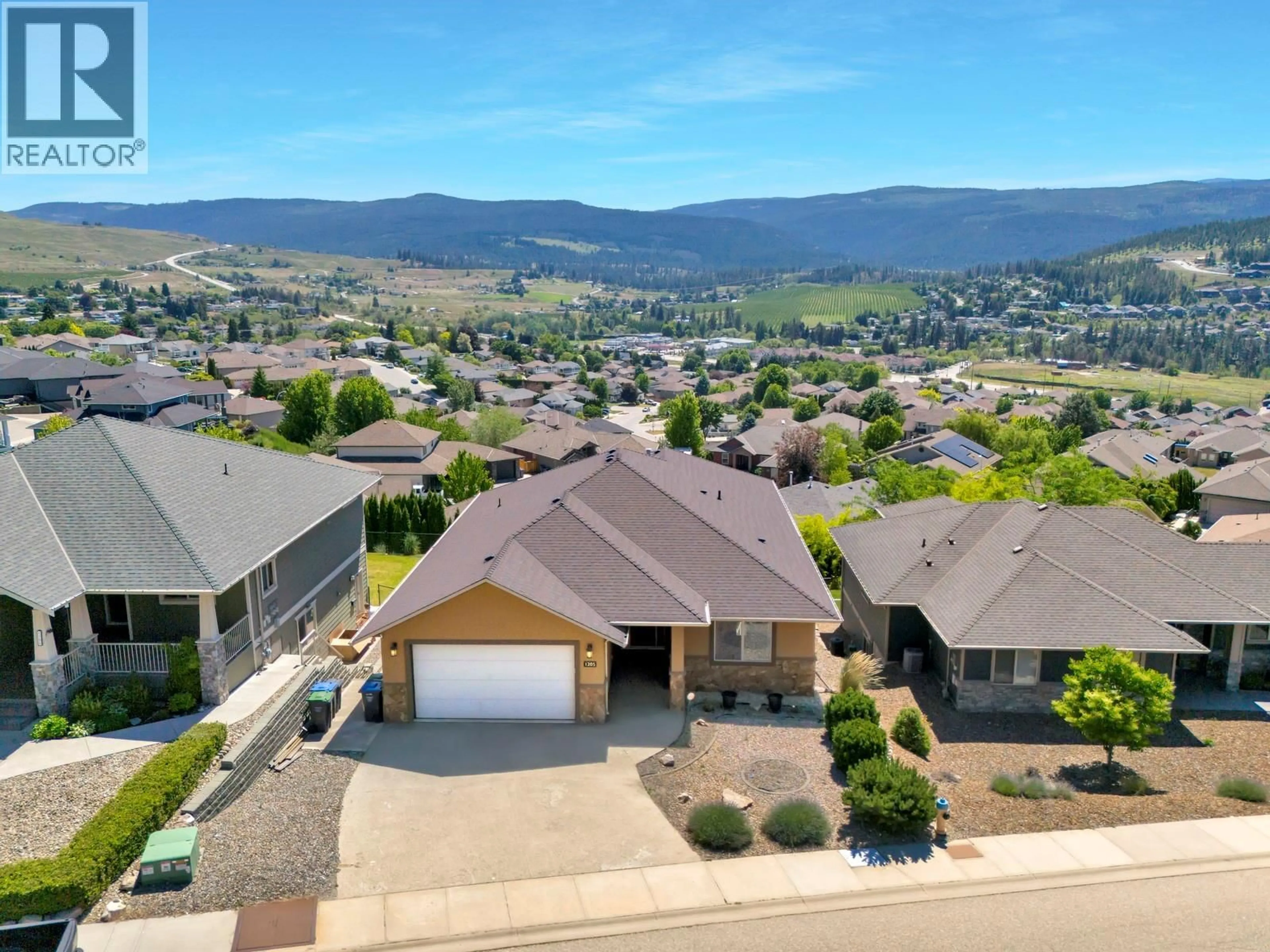 A pic from outside/outdoor area/front of a property/back of a property/a pic from drone, mountain view for 1205 LOSETH DRIVE, Kelowna British Columbia V1P1S2