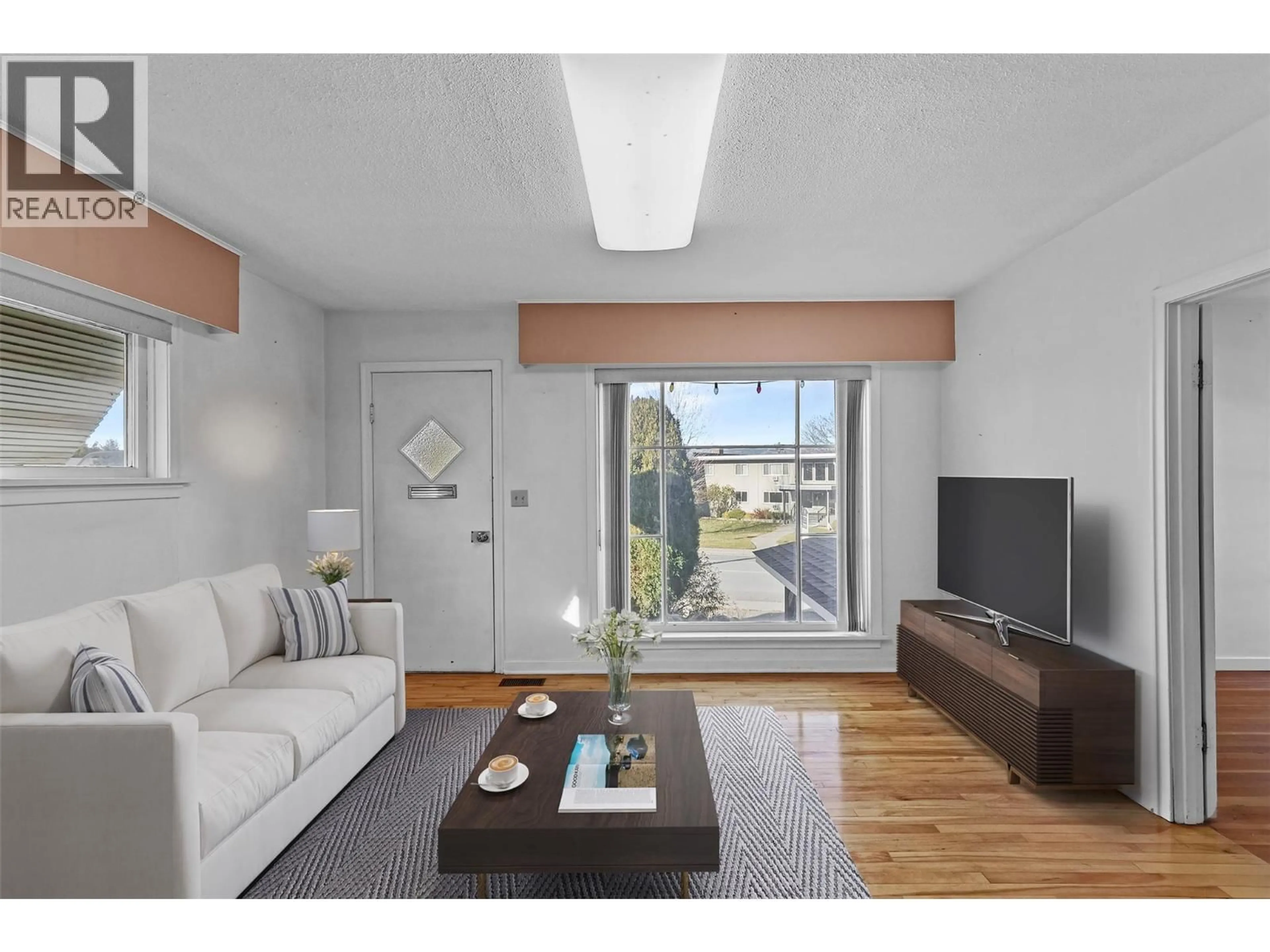 Living room with furniture, wood/laminate floor for 1335 COLUMBIA STREET, Kamloops British Columbia V2C2W6