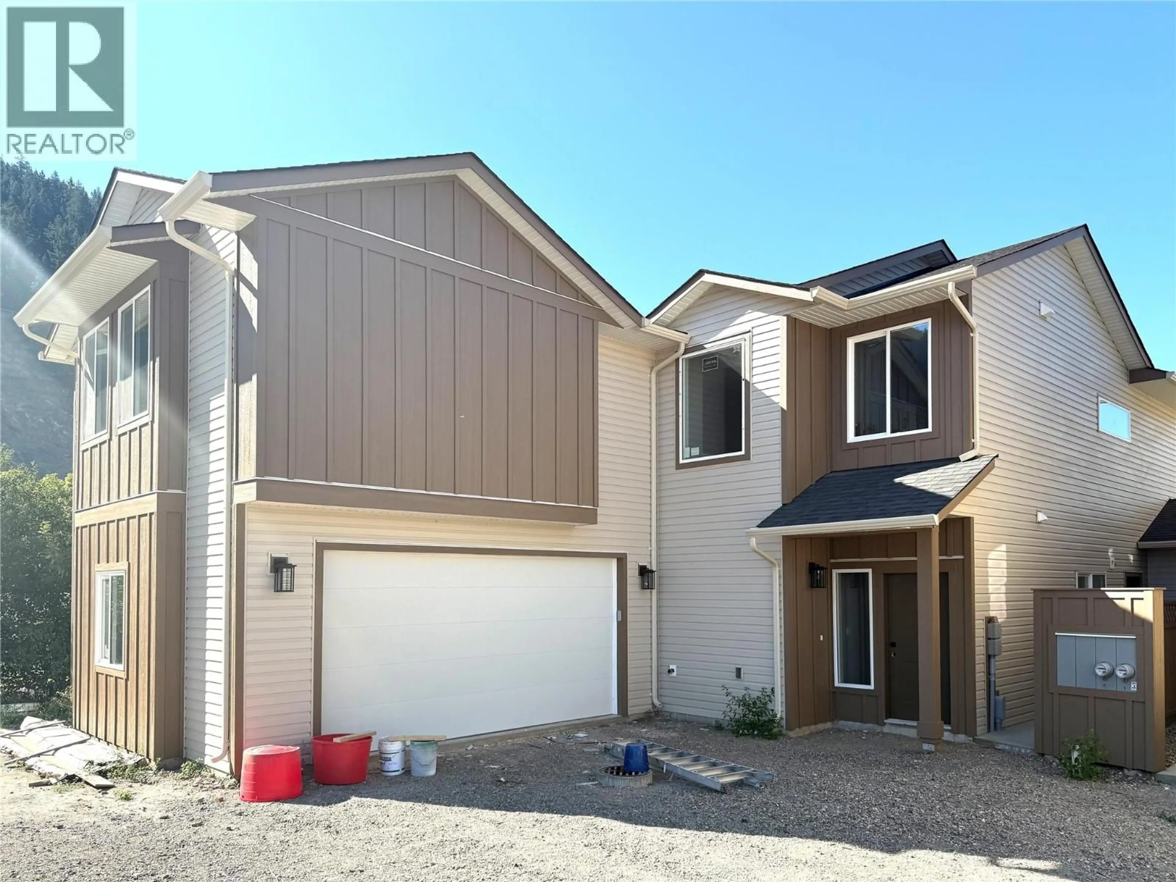 Home with vinyl exterior material, street for 302 BROOKE DRIVE, Chase British Columbia V0E1M0