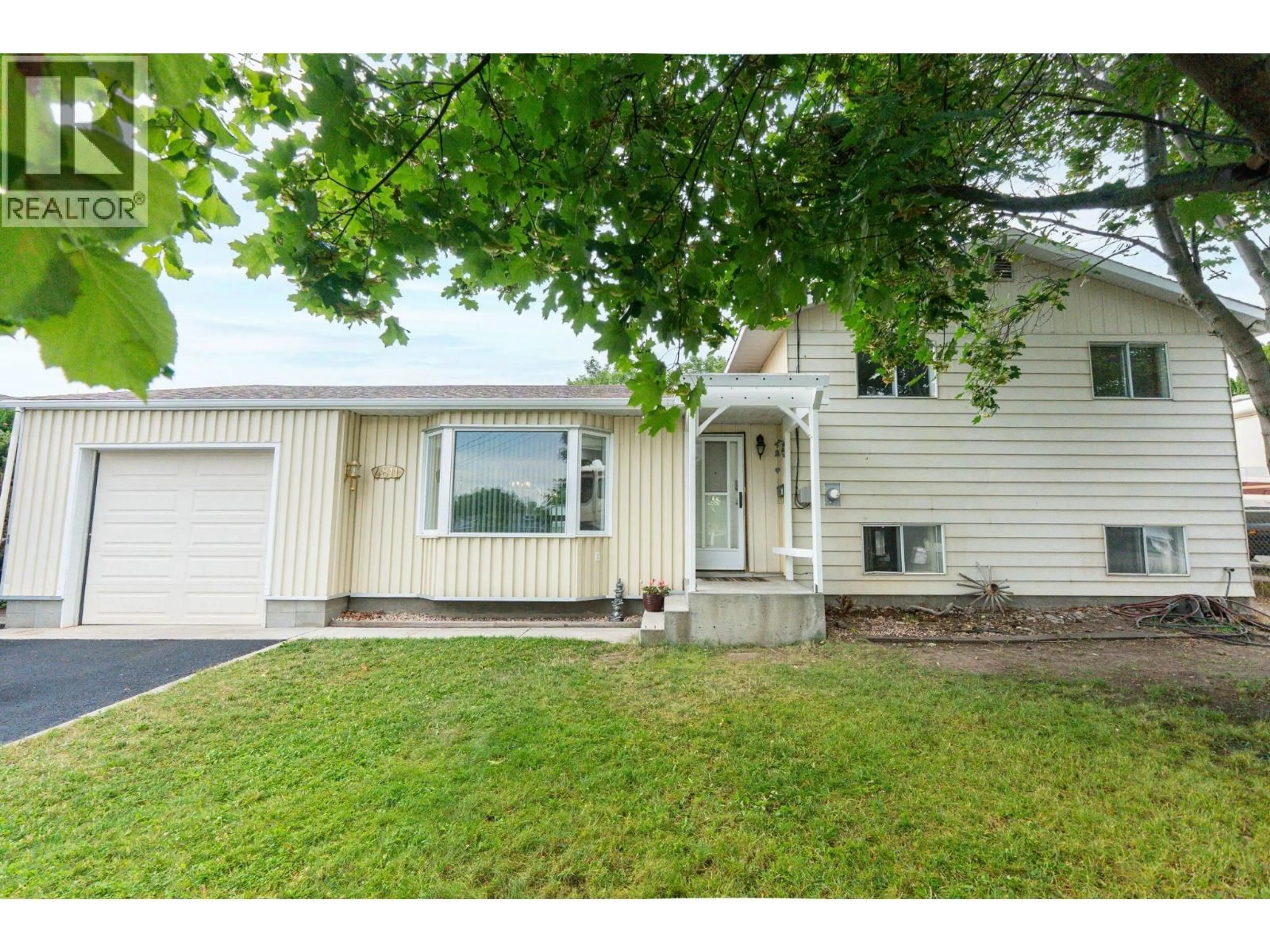 Home with vinyl exterior material, street for 4811 PARKDALE CRESCENT, Ellison British Columbia V1X6T3