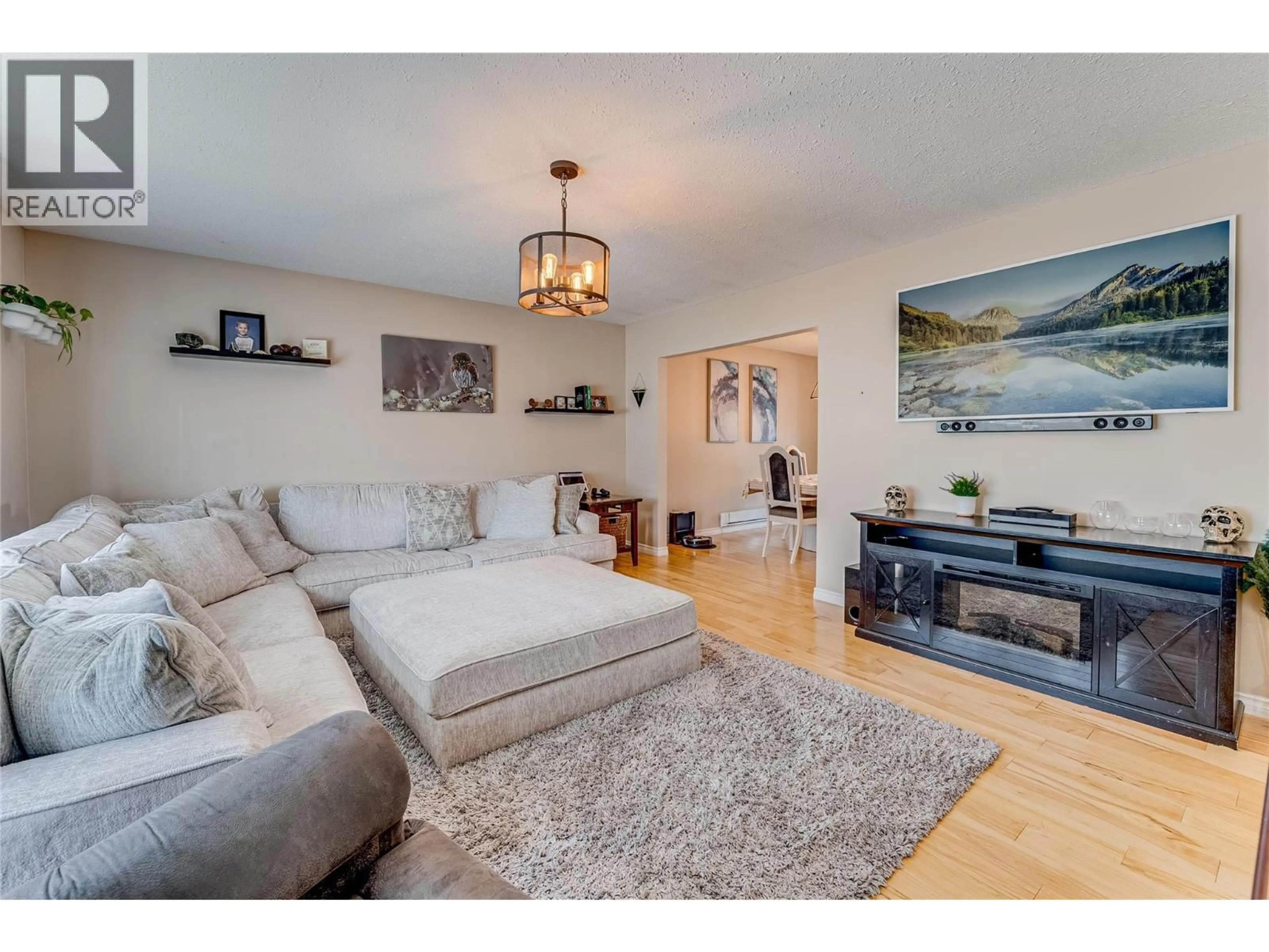 Living room with furniture, wood/laminate floor for 101 CRESCENT DRIVE, Enderby British Columbia V0E1V2