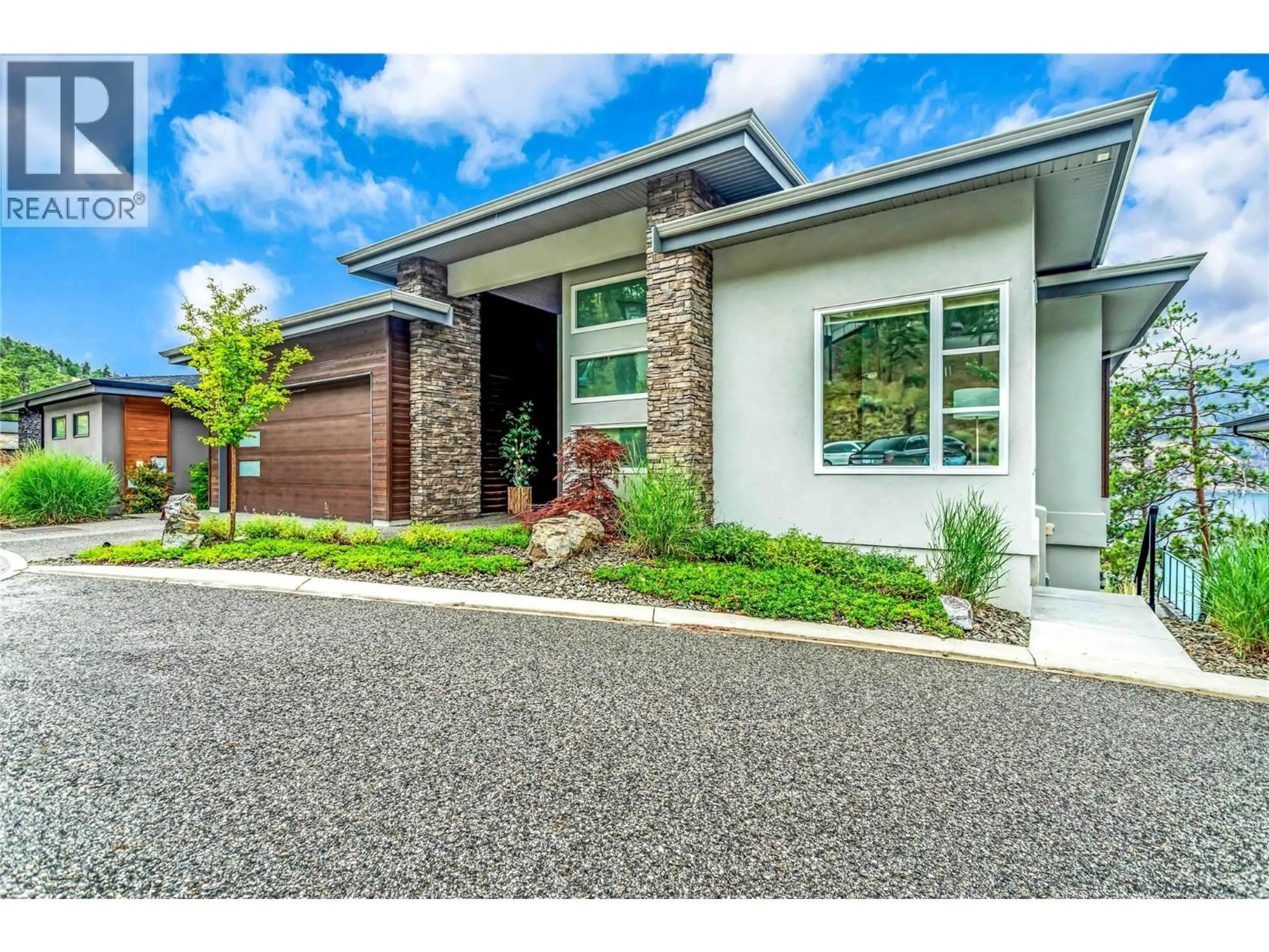Home with brick exterior material, street for 3452 BLUE GRASS LANE, Kelowna British Columbia V1V3G1