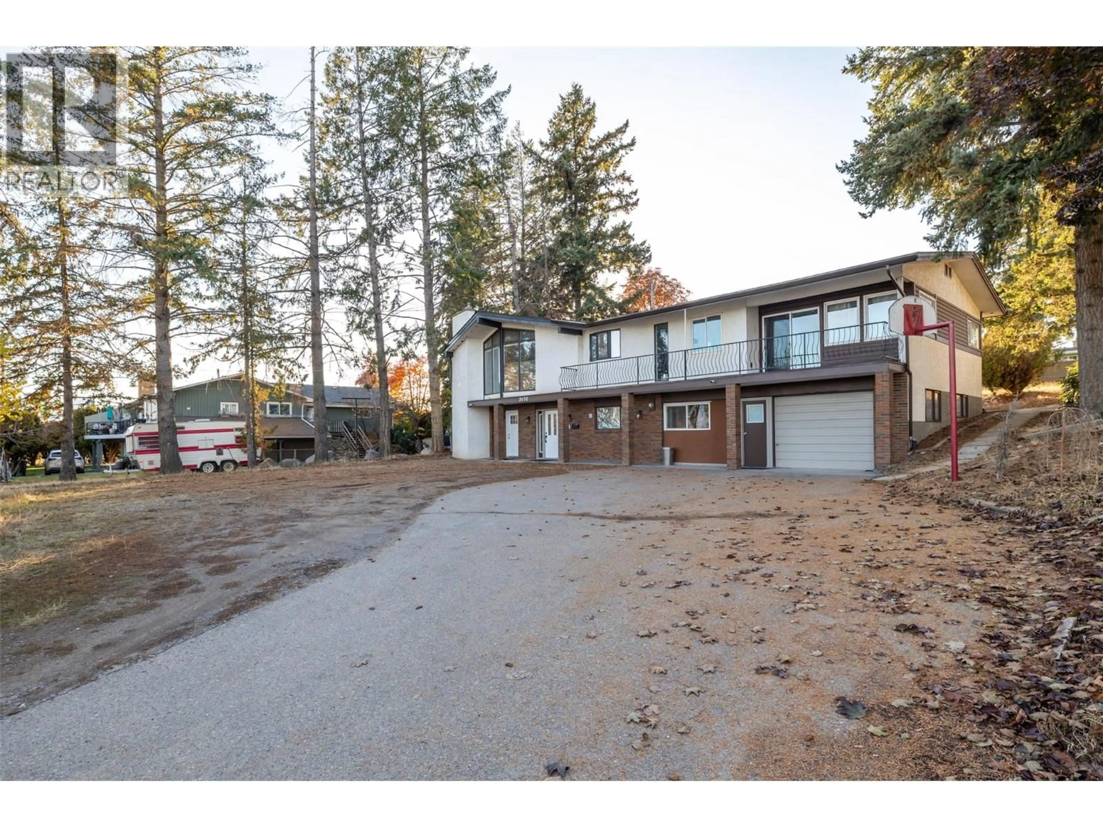 A pic from outside/outdoor area/front of a property/back of a property/a pic from drone, street for 2650 THACKER DRIVE, West Kelowna British Columbia V1Z1W3