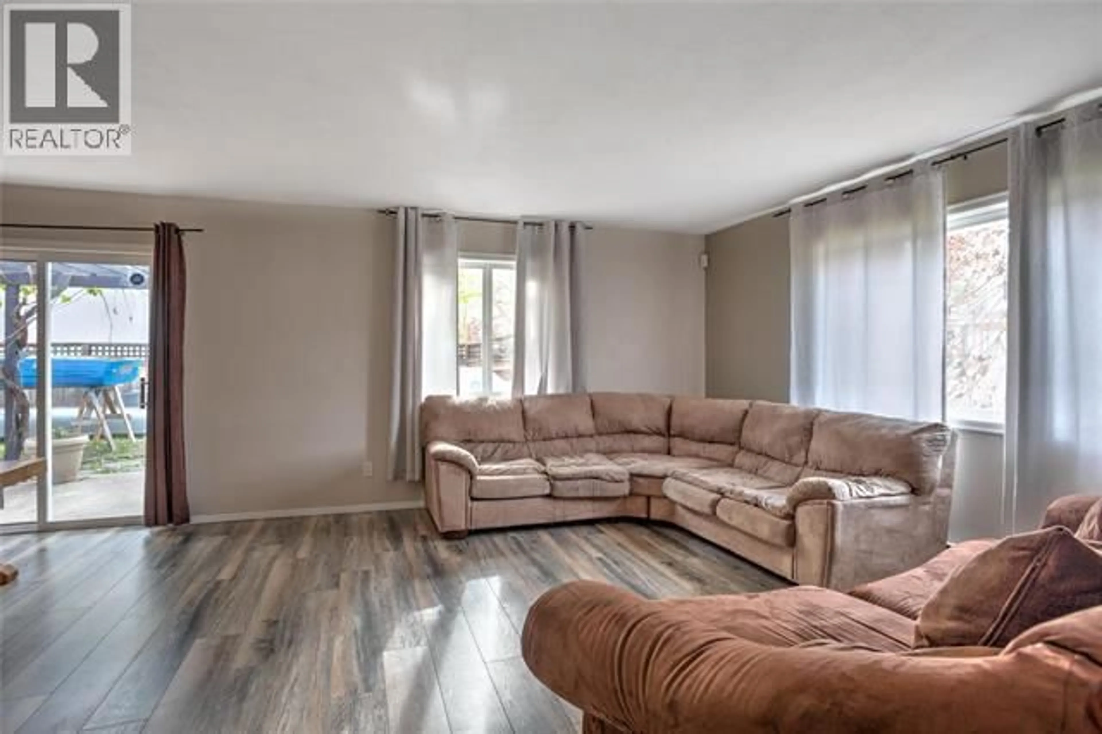 Living room with furniture, unknown for 331-351 PHIPPS CRESCENT, Kelowna British Columbia V1V2T2