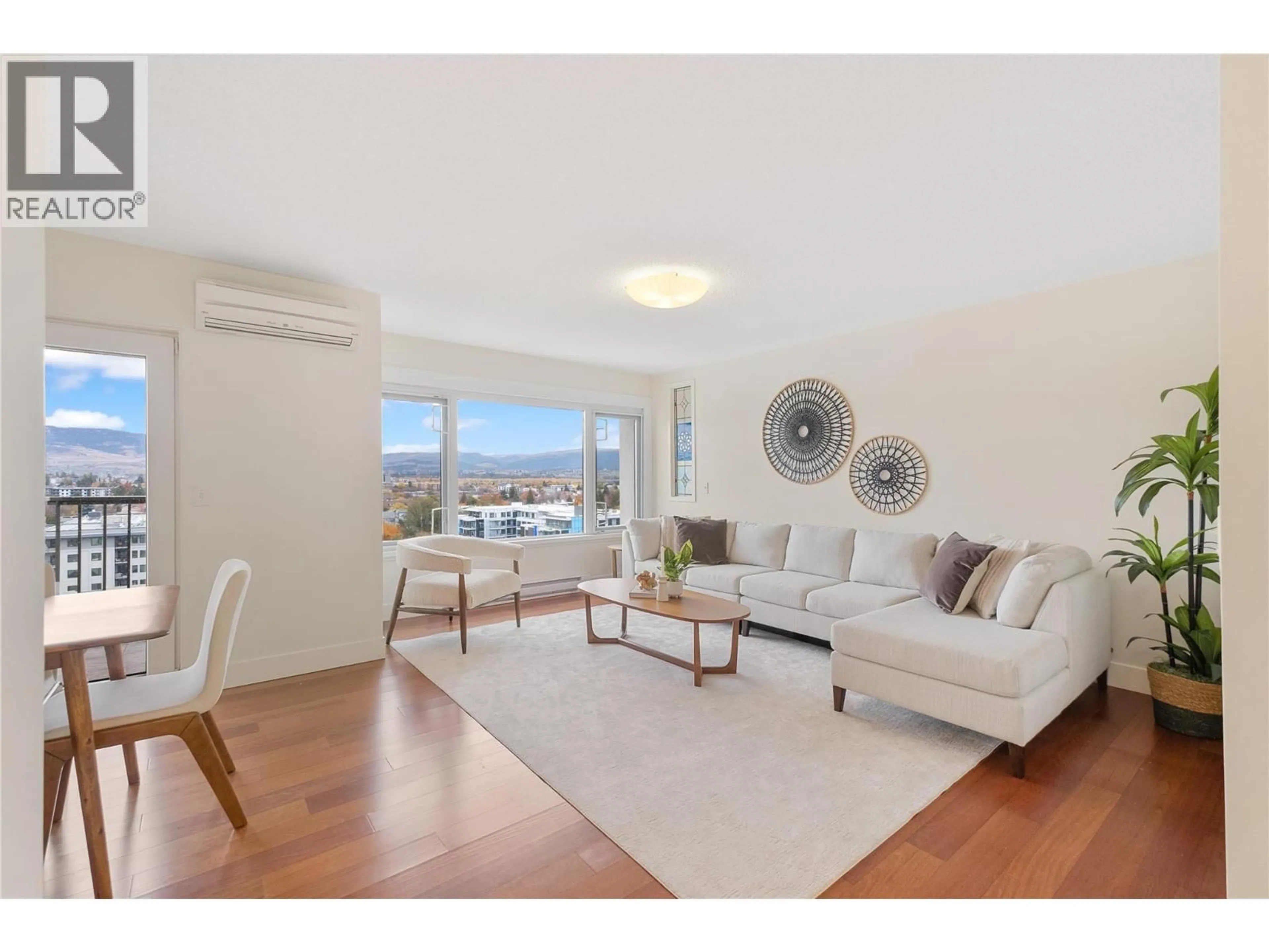 Living room with furniture, wood/laminate floor for 1206 - 737 LEON AVENUE, Kelowna British Columbia V1Y8L6