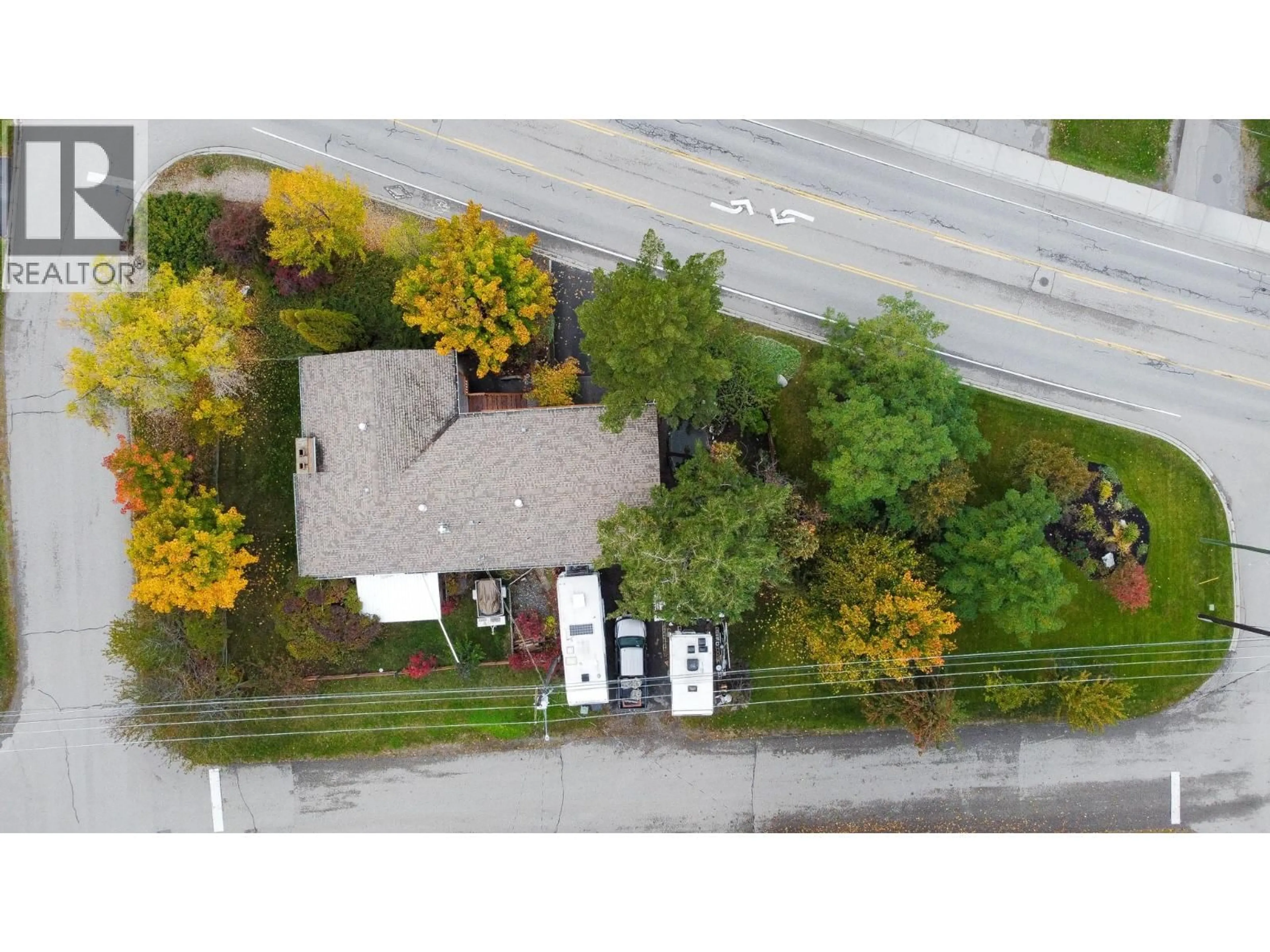 A pic from outside/outdoor area/front of a property/back of a property/a pic from drone, street for 1801 MISSION ROAD, Vernon British Columbia V1T5Z4