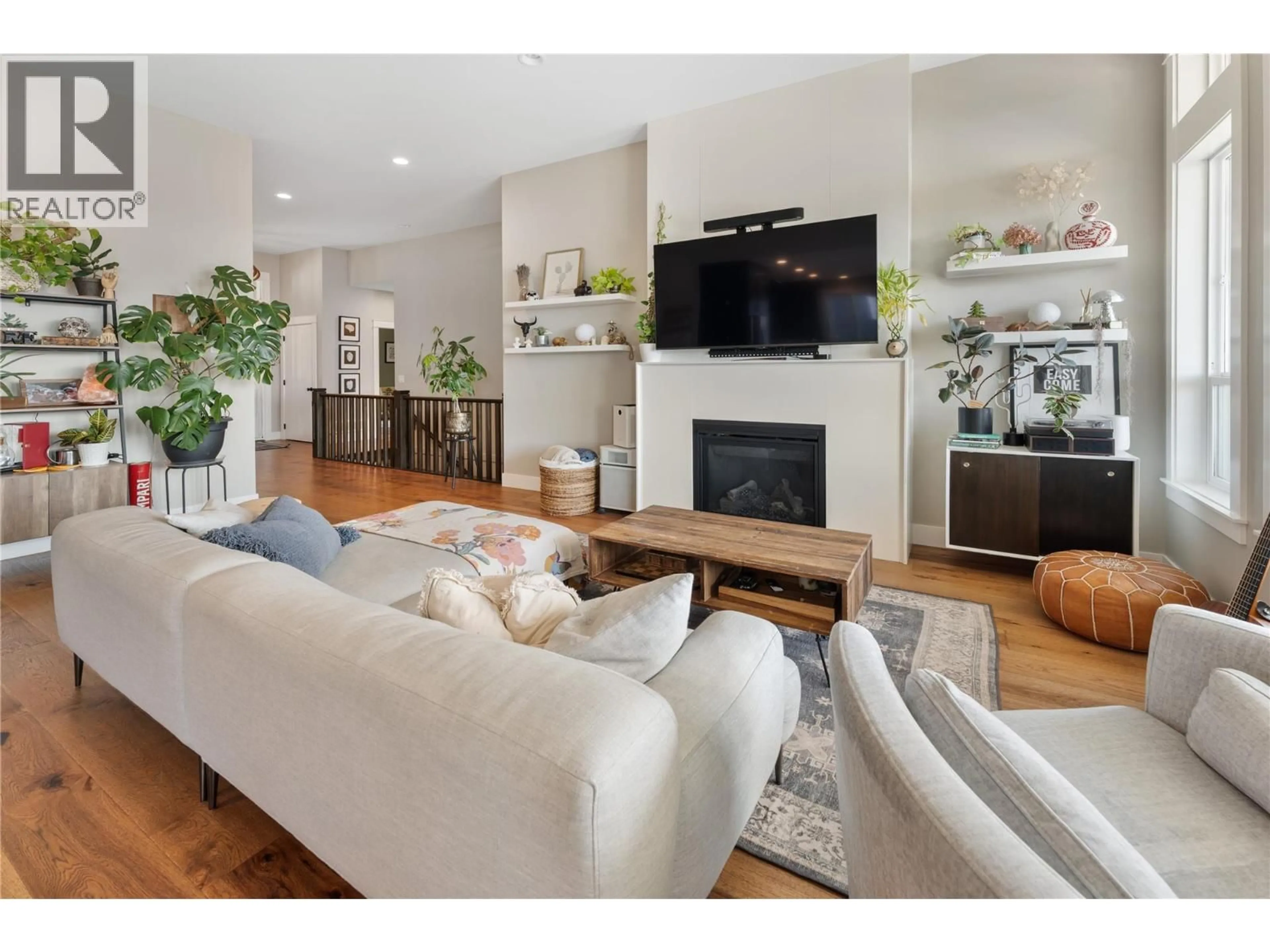 Living room with furniture, wood/laminate floor for 13301 APEX LANE, Lake Country British Columbia V4V2W3
