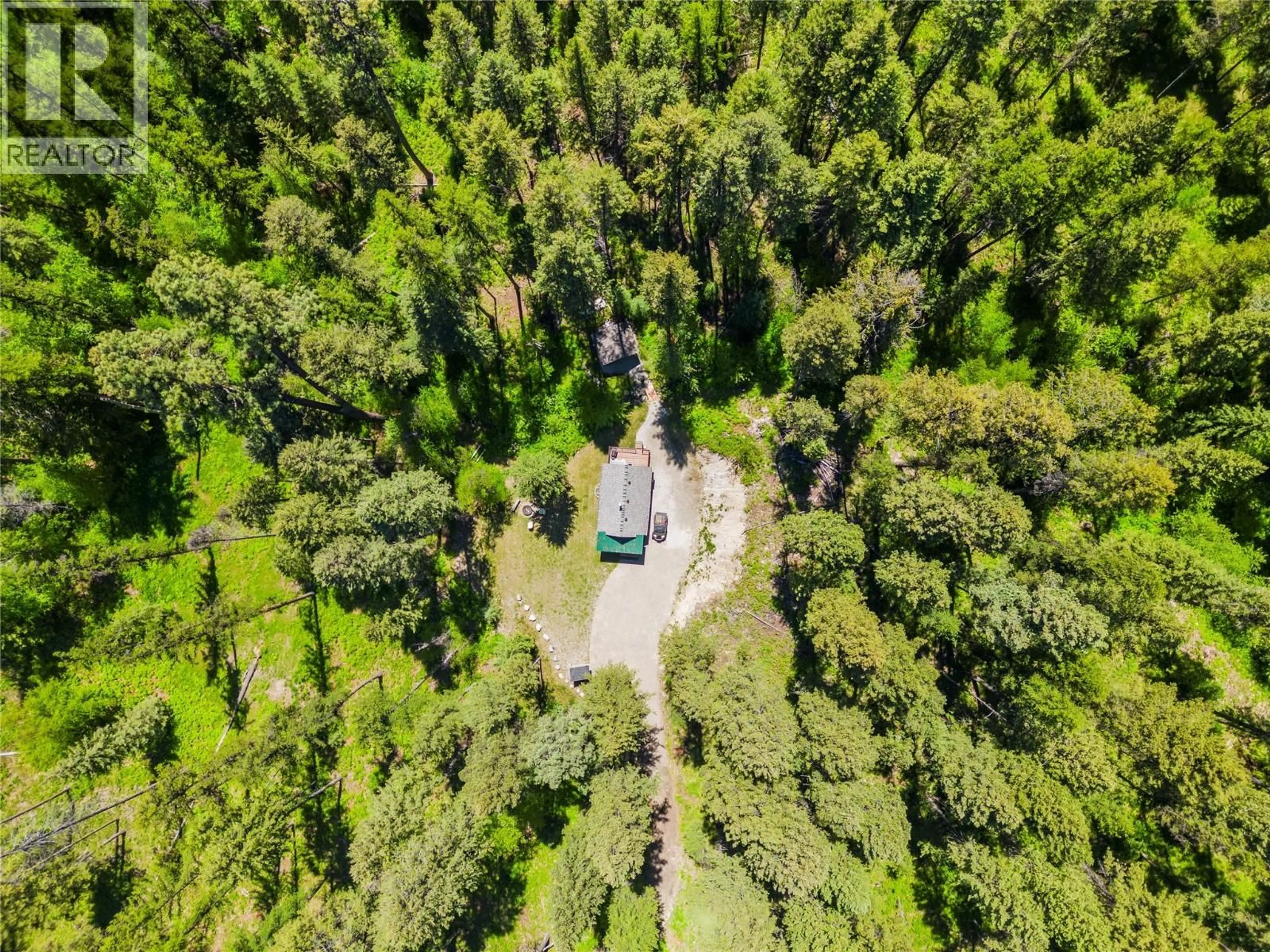 A pic from outside/outdoor area/front of a property/back of a property/a pic from drone, forest/trees view for 5950 CROUSE CREEK FOREST, Westbridge British Columbia V0H2B0