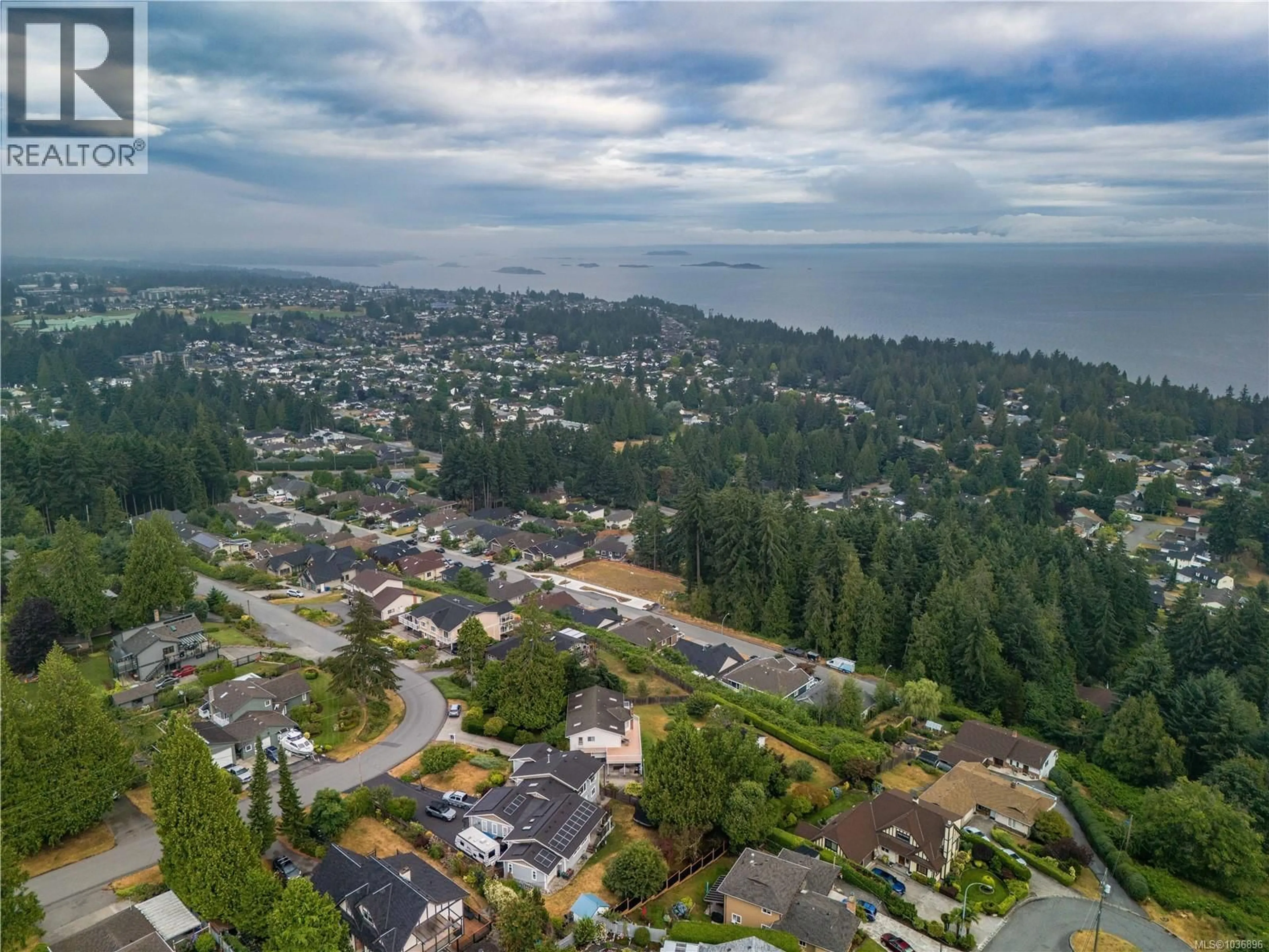 A pic from outside/outdoor area/front of a property/back of a property/a pic from drone, water/lake/river/ocean view for 5650 ALDER WAY, Nanaimo British Columbia V9T5N4