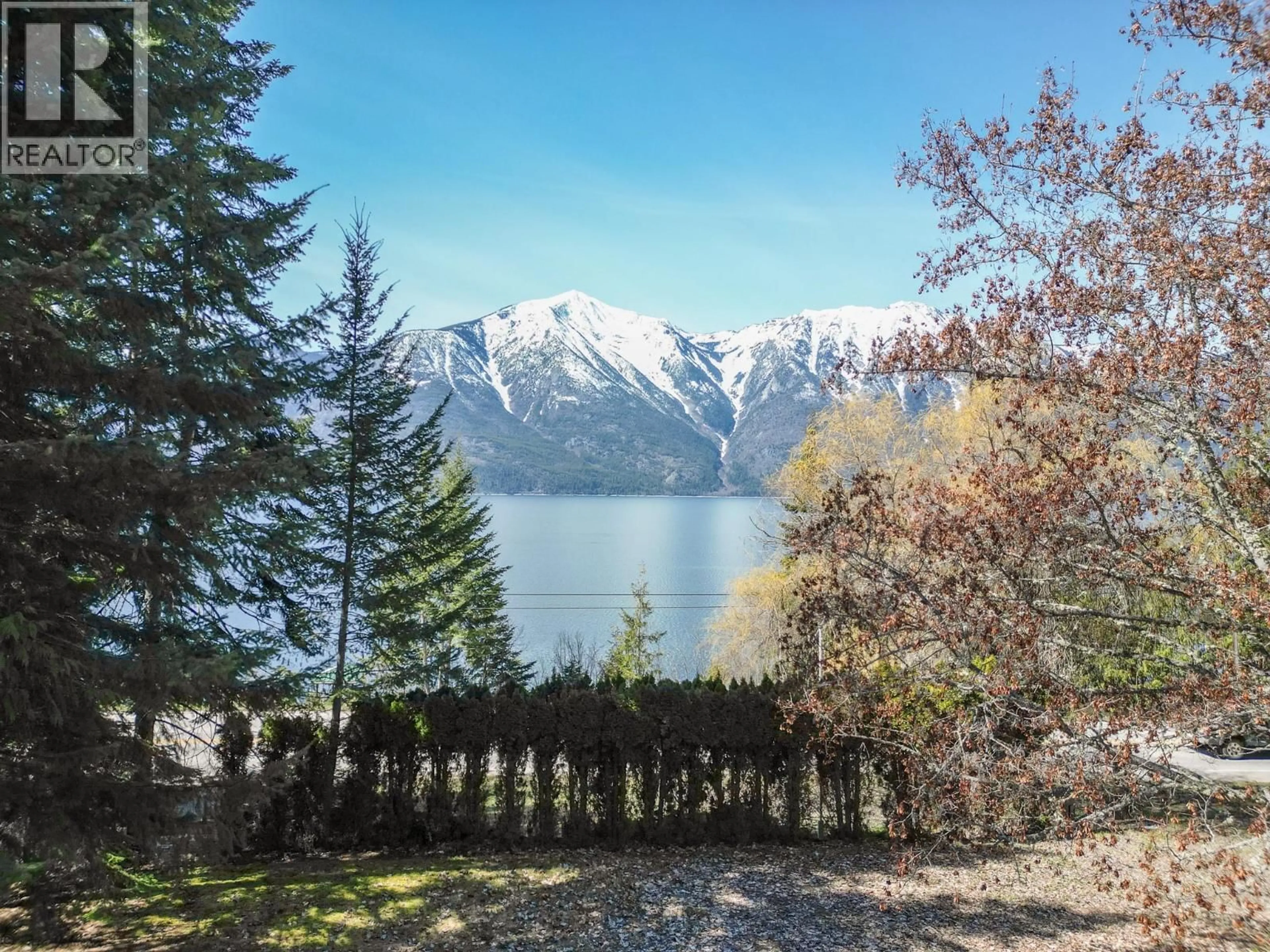 A pic from outside/outdoor area/front of a property/back of a property/a pic from drone, water/lake/river/ocean view for 12830 3A HIGHWAY, Boswell British Columbia V0B1A4