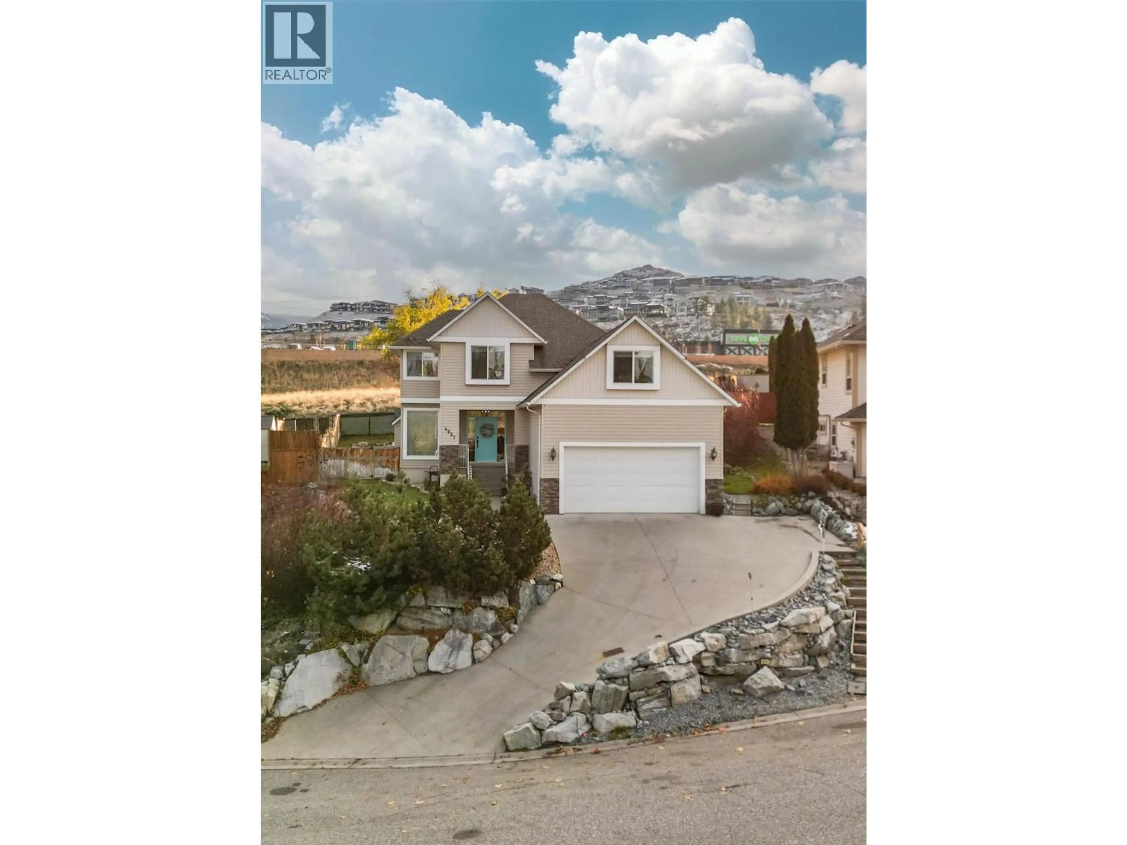 A pic from outside/outdoor area/front of a property/back of a property/a pic from drone, water/lake/river/ocean view for 4897 WARBLER COURT, Kelowna British Columbia V1W5A1