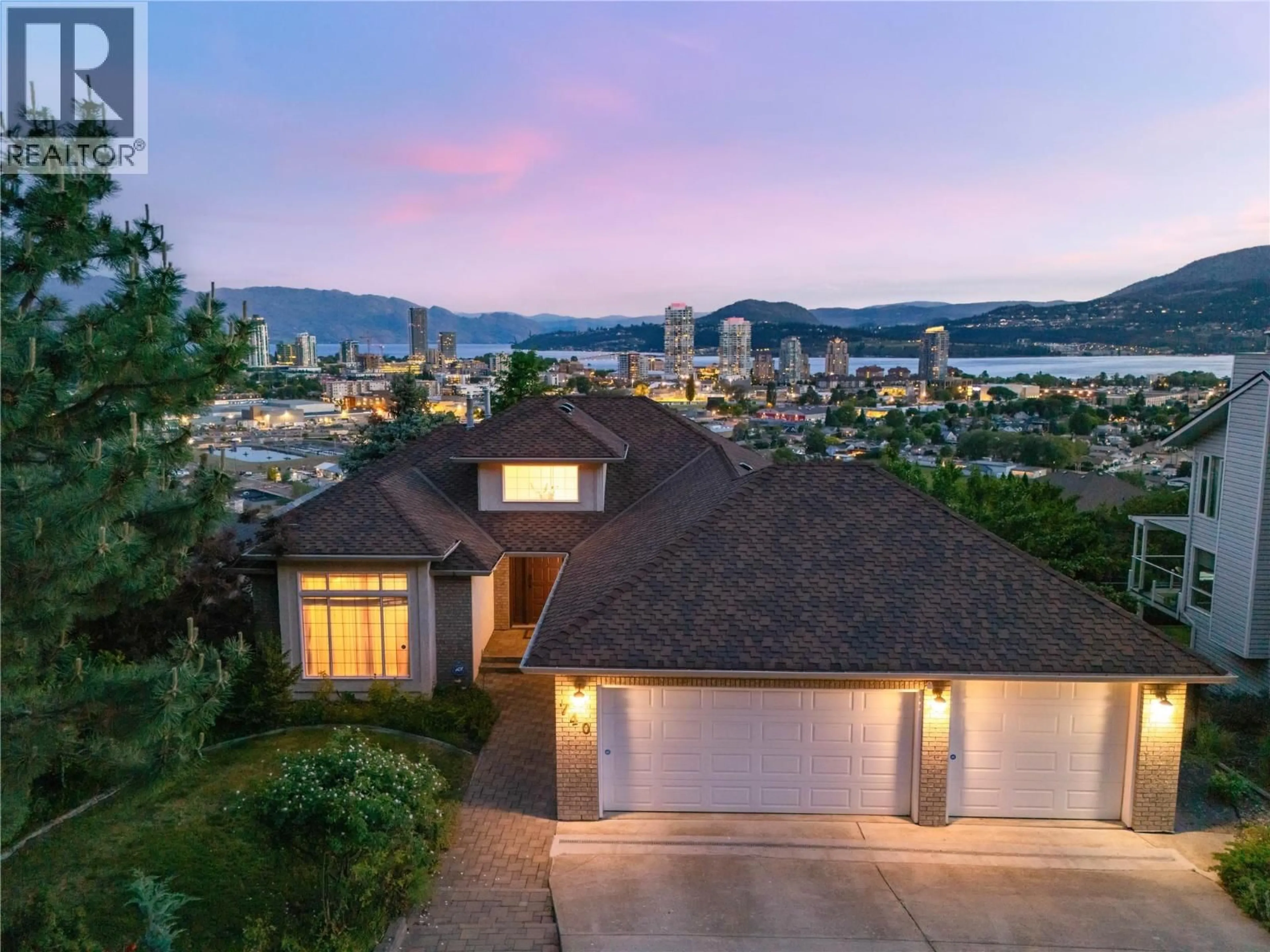 A pic from outside/outdoor area/front of a property/back of a property/a pic from drone, mountain view for 740 ROYAL PINE DRIVE, Kelowna British Columbia V1Y9G2
