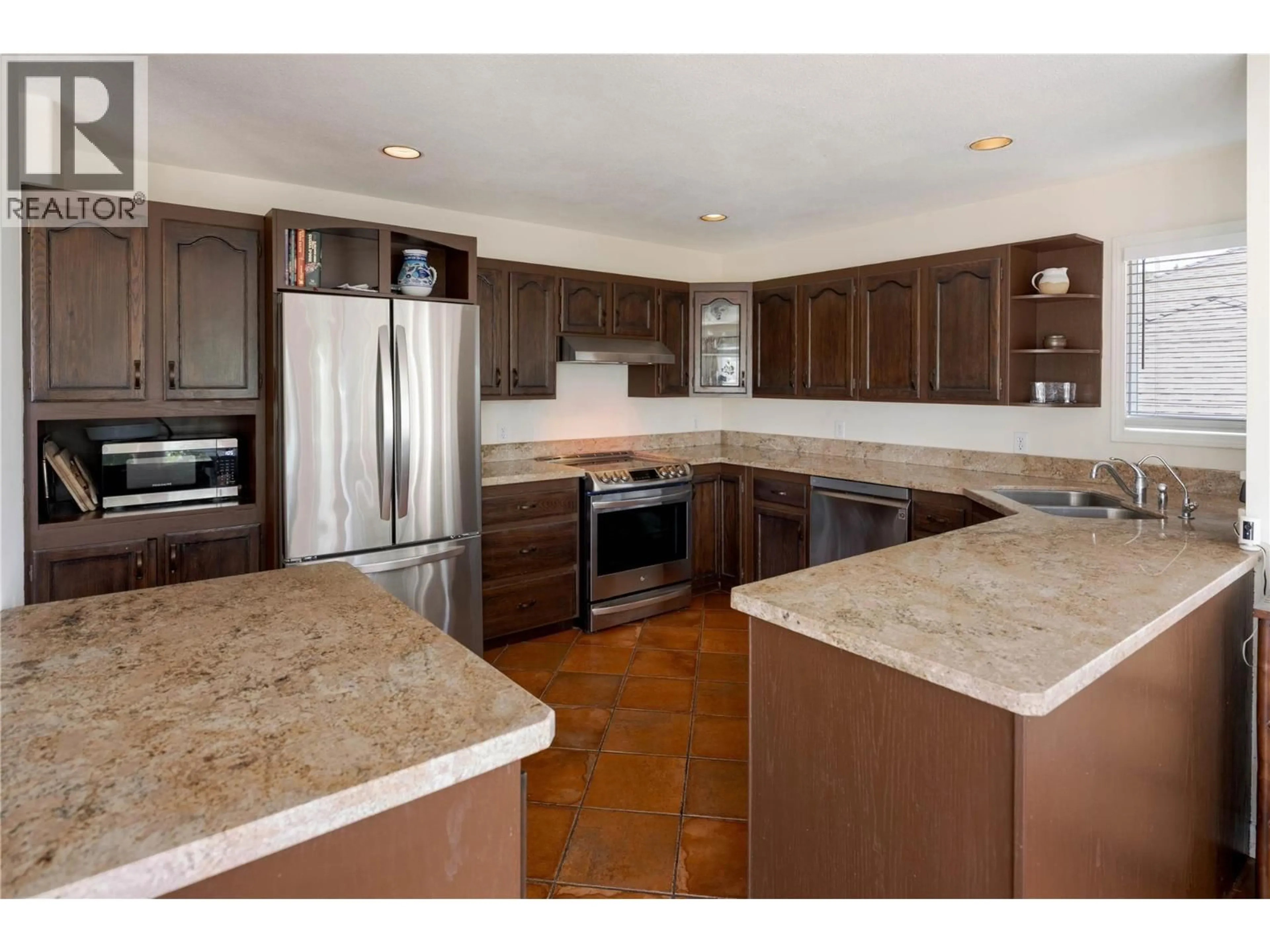 Open concept kitchen, ceramic/tile floor for 740 ROYAL PINE DRIVE, Kelowna British Columbia V1Y9G2