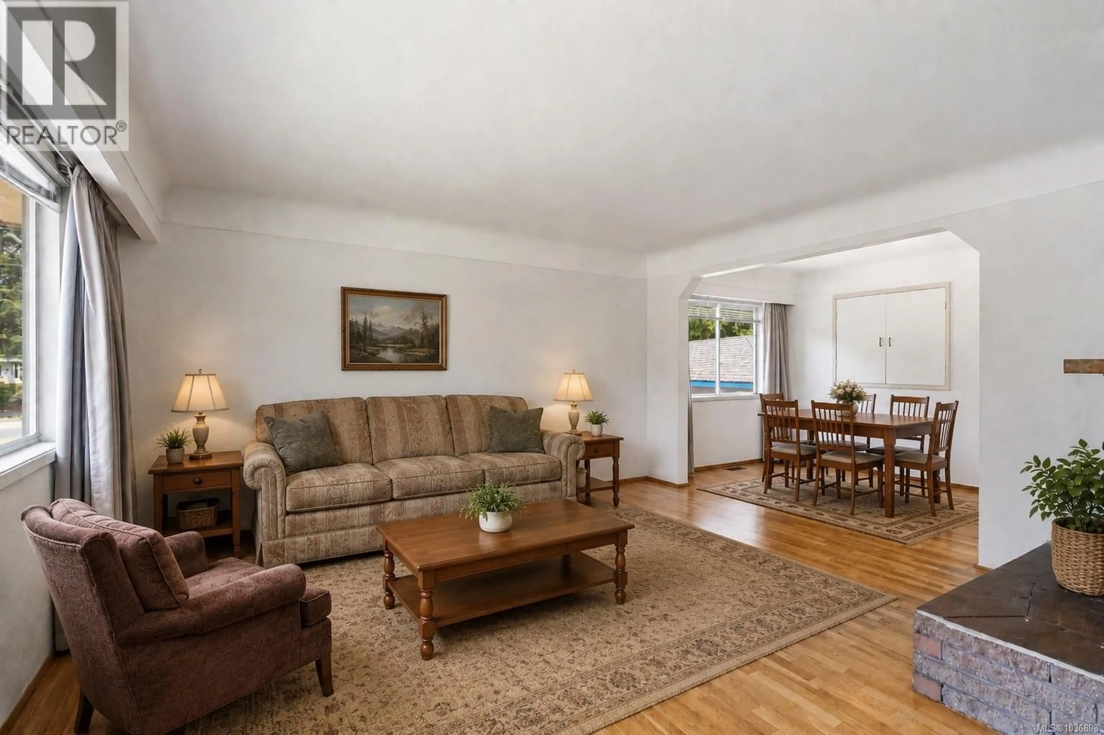Living room with furniture, wood/laminate floor for 993 MCCALLUM ROAD, Langford British Columbia V9B4C7