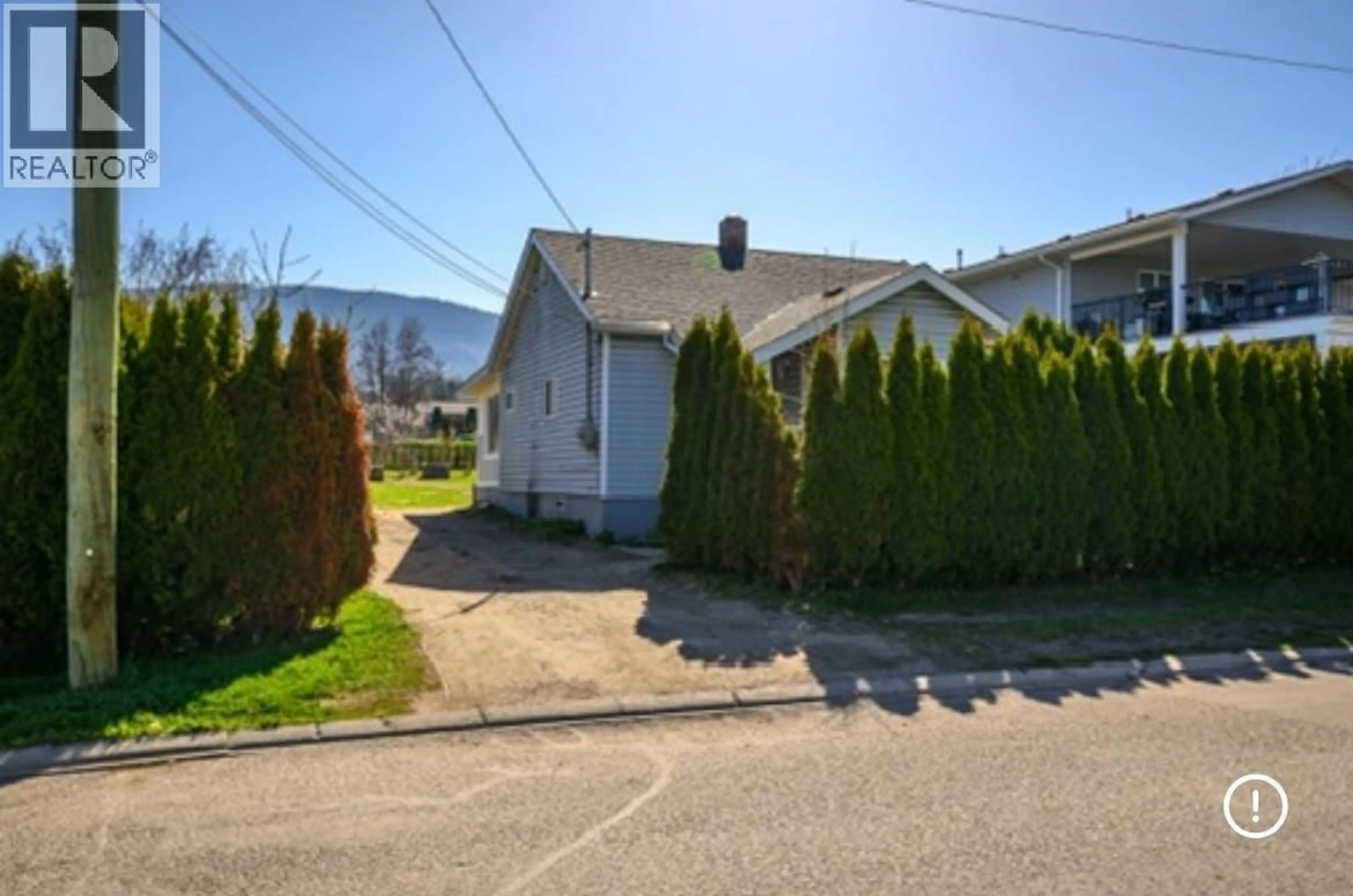 A pic from outside/outdoor area/front of a property/back of a property/a pic from drone, street for 4005 24 STREET, Vernon British Columbia V1T4N7