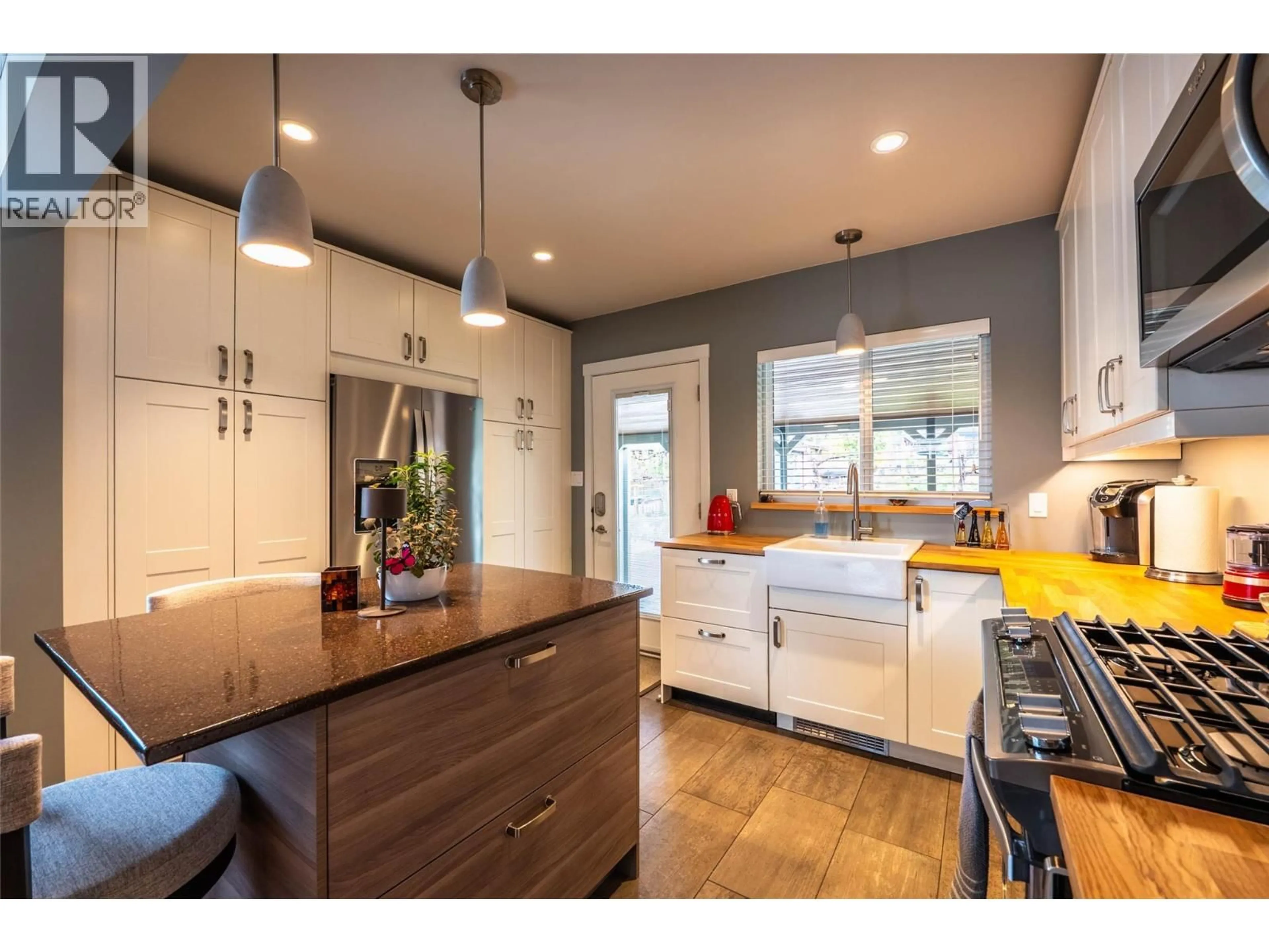 Open concept kitchen, wood/laminate floor for 1519 STANLEY STREET, Nelson British Columbia V1L1R4