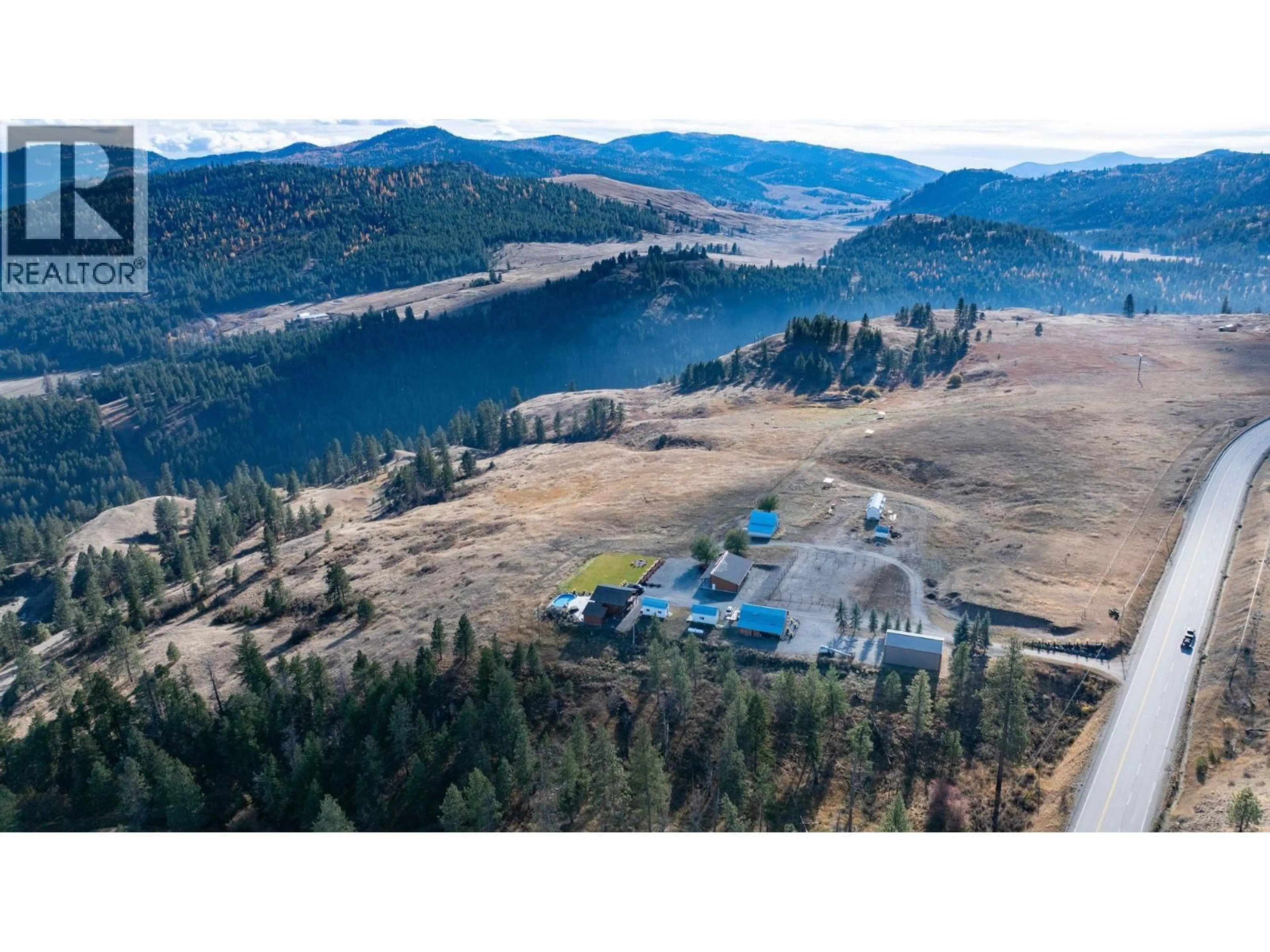 A pic from outside/outdoor area/front of a property/back of a property/a pic from drone, mountain view for 4520 HIGHWAY 3 OTHER, Rock Creek British Columbia V0H1Y0